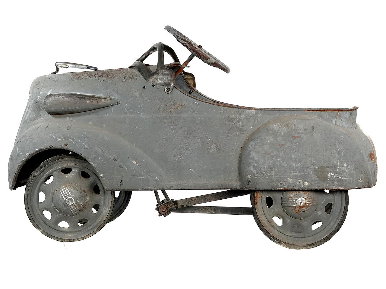 This is a very hard to find 1936 Steelcraft Ford V8 pedal car sedan coupe roadster. The car has a nice weathered patina with just the right look.