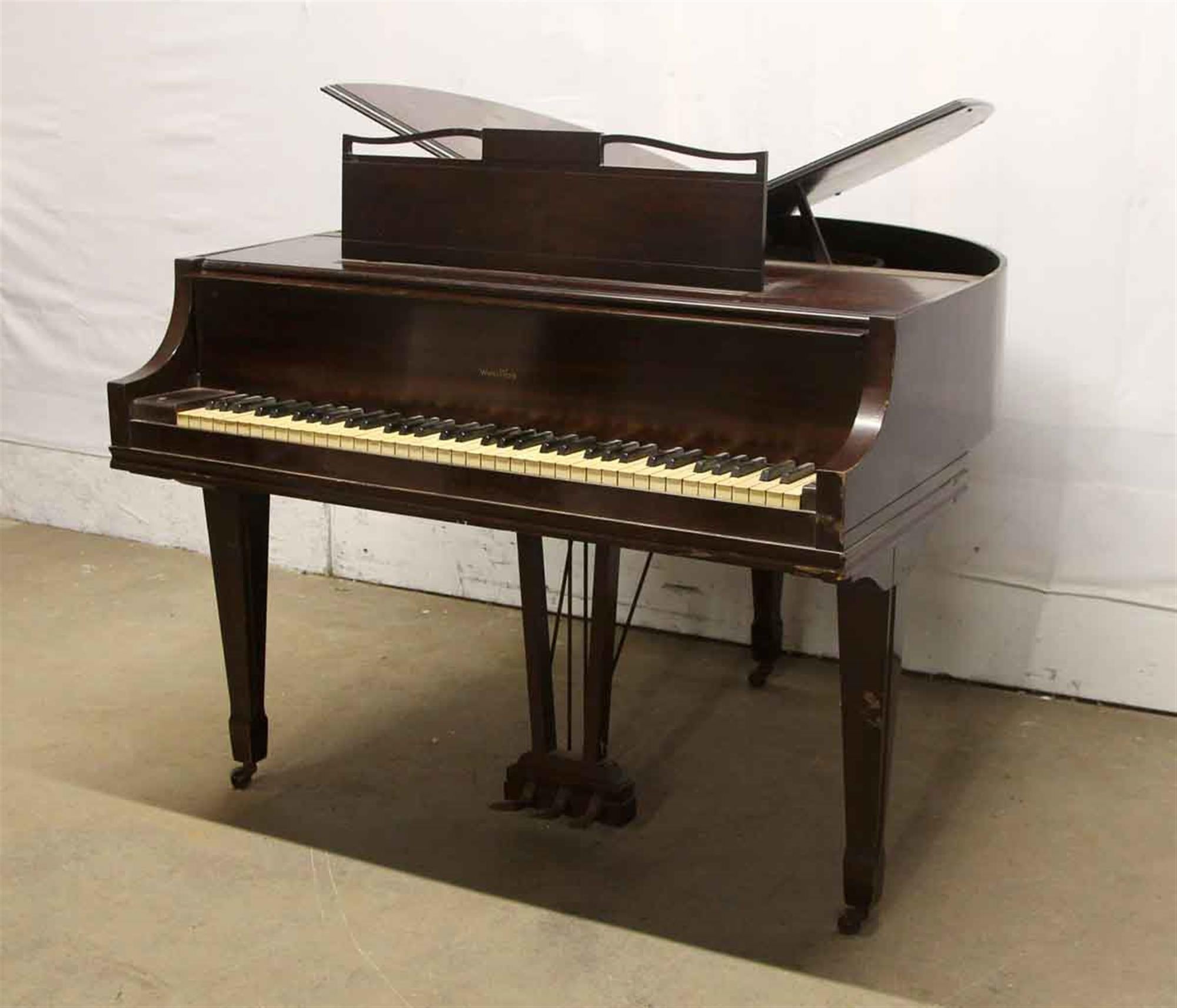 Rare butterfly baby grand piano built by the Rudolph Wurlitzer Piano & Organ Company in 1937. Wurlitzer built a limited number of these piano's during the 1930s and 1940s. Sought after by collectors and musicians alike. Needs restoration. This can