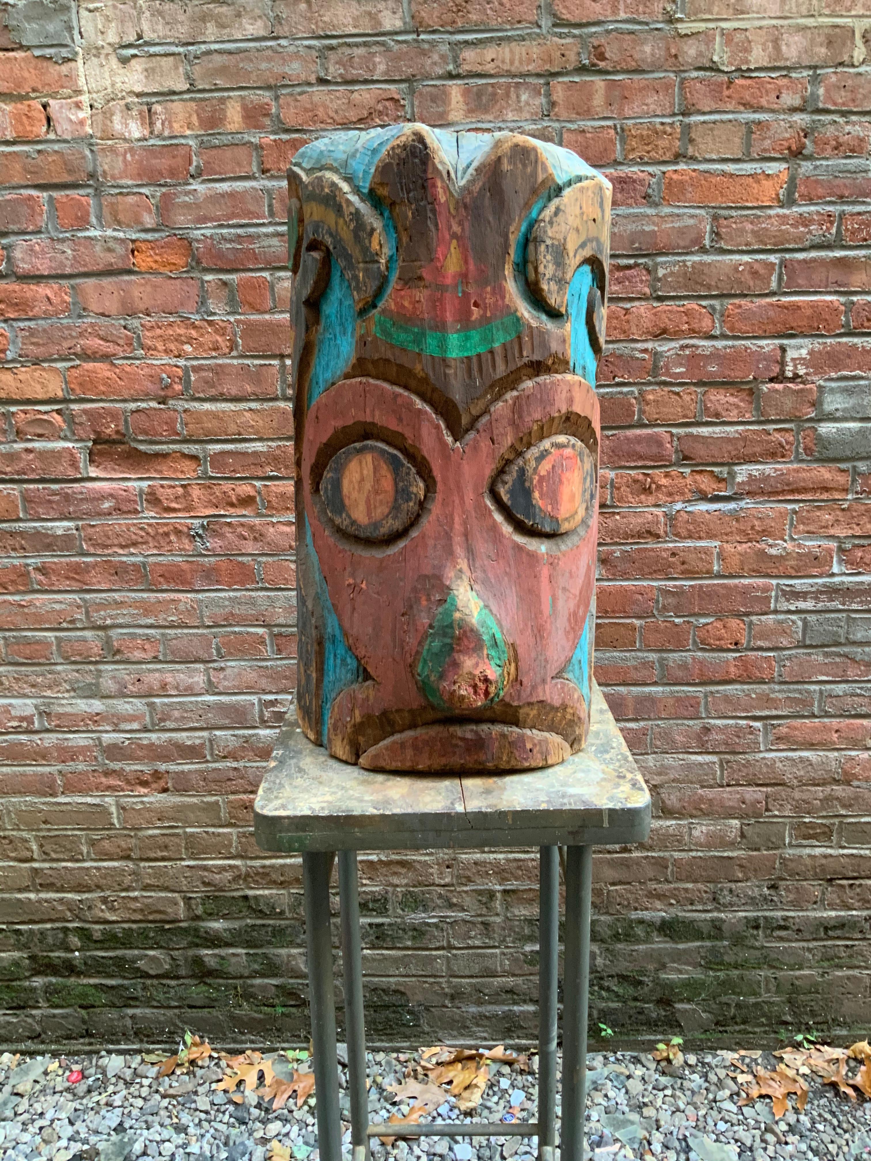 Initialled and dated, CF 1937, carved and painted Pacific Northwest Native American TOTEM. The carved decoration is indicative of the style and manner of TOTEM carvers in Washington State or British Colombia. Carved from a solid piece of wood