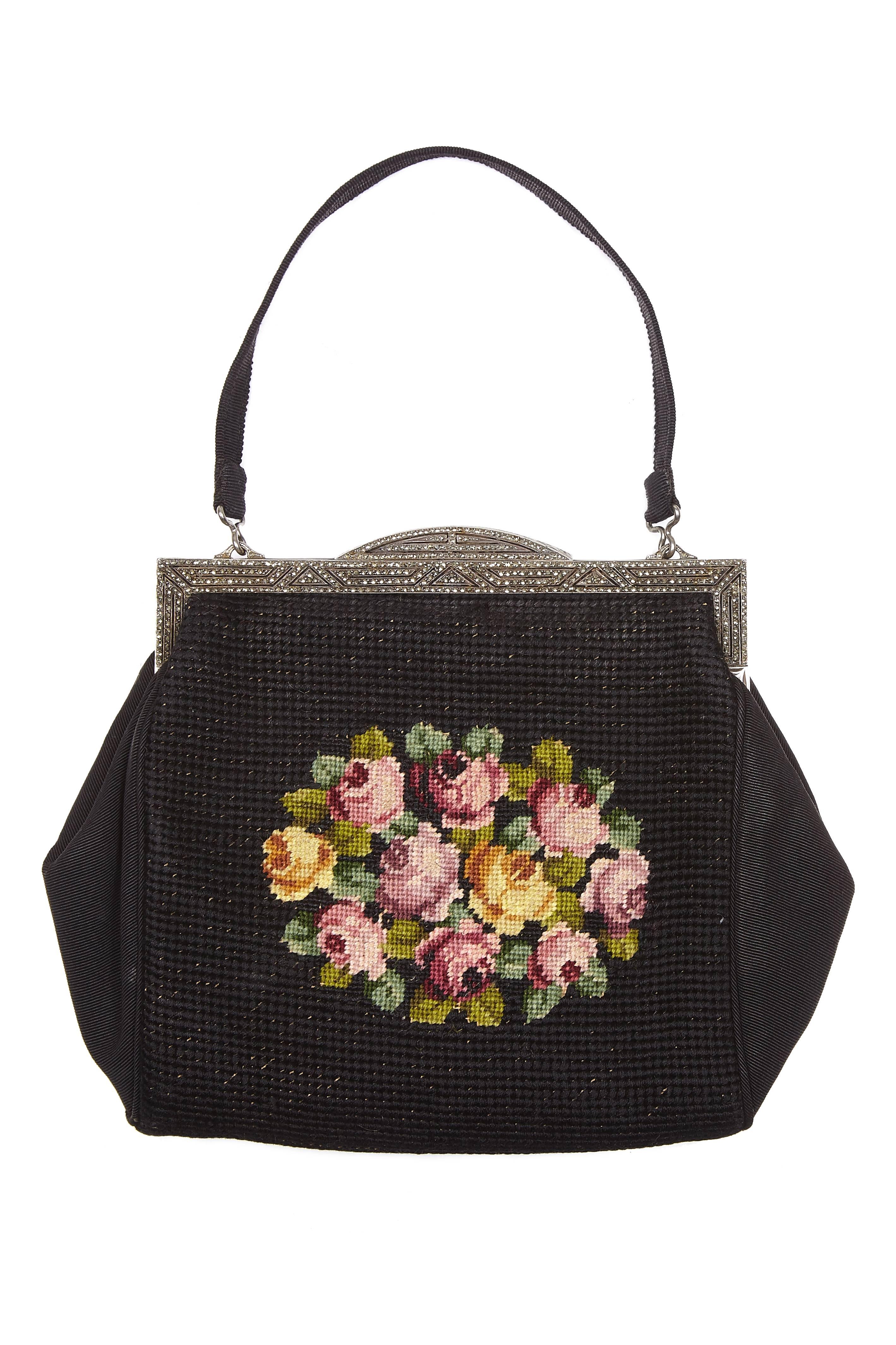Exceptional art deco black grosgrain fabric and tapestry bag with hand-stitched floral needlework motive which features on both sides.  The frame is solid sterling silver with import marks for London 1937 - 1938.  The makers' mark is R L & Co.  The