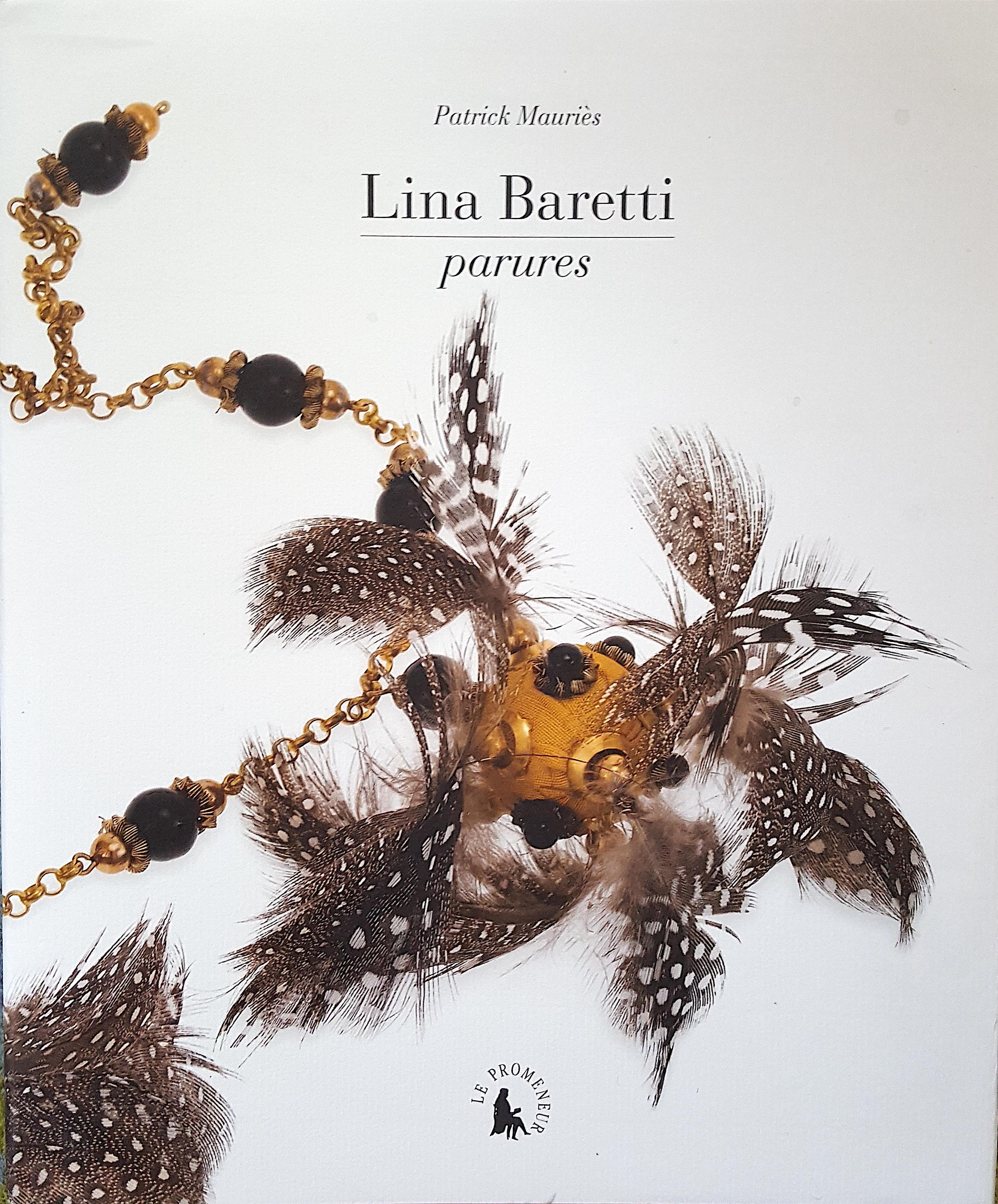 Unusually decorated with small partridge feathers like the yellow-gold gilt necklace commissioned by Elsa Schiaparelli (1890-1973) that is featured on the front-and-back covers and centerfold of the French costume-jewelry hardcover book, Lina
