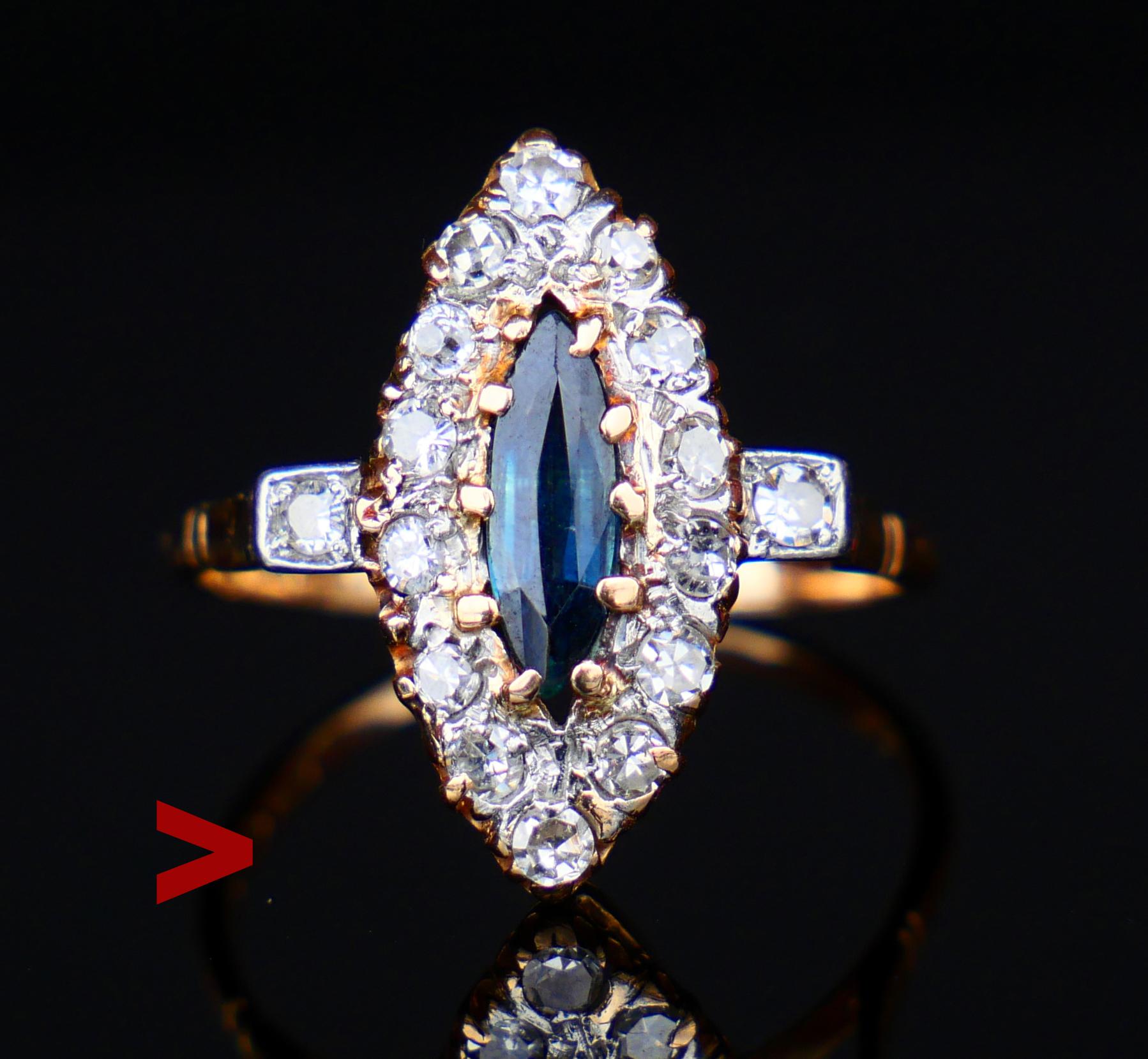 Dieser Ring hat eine navette- oder bootförmige Krone mit Platinclustern, die in massivem 18K Rose Gold eingeschmolzen sind. Der zentrale Stein ist ein natürlicher blauer Saphir im Marquiseschliff, umgeben von 16 Diamanten im alten europäischen