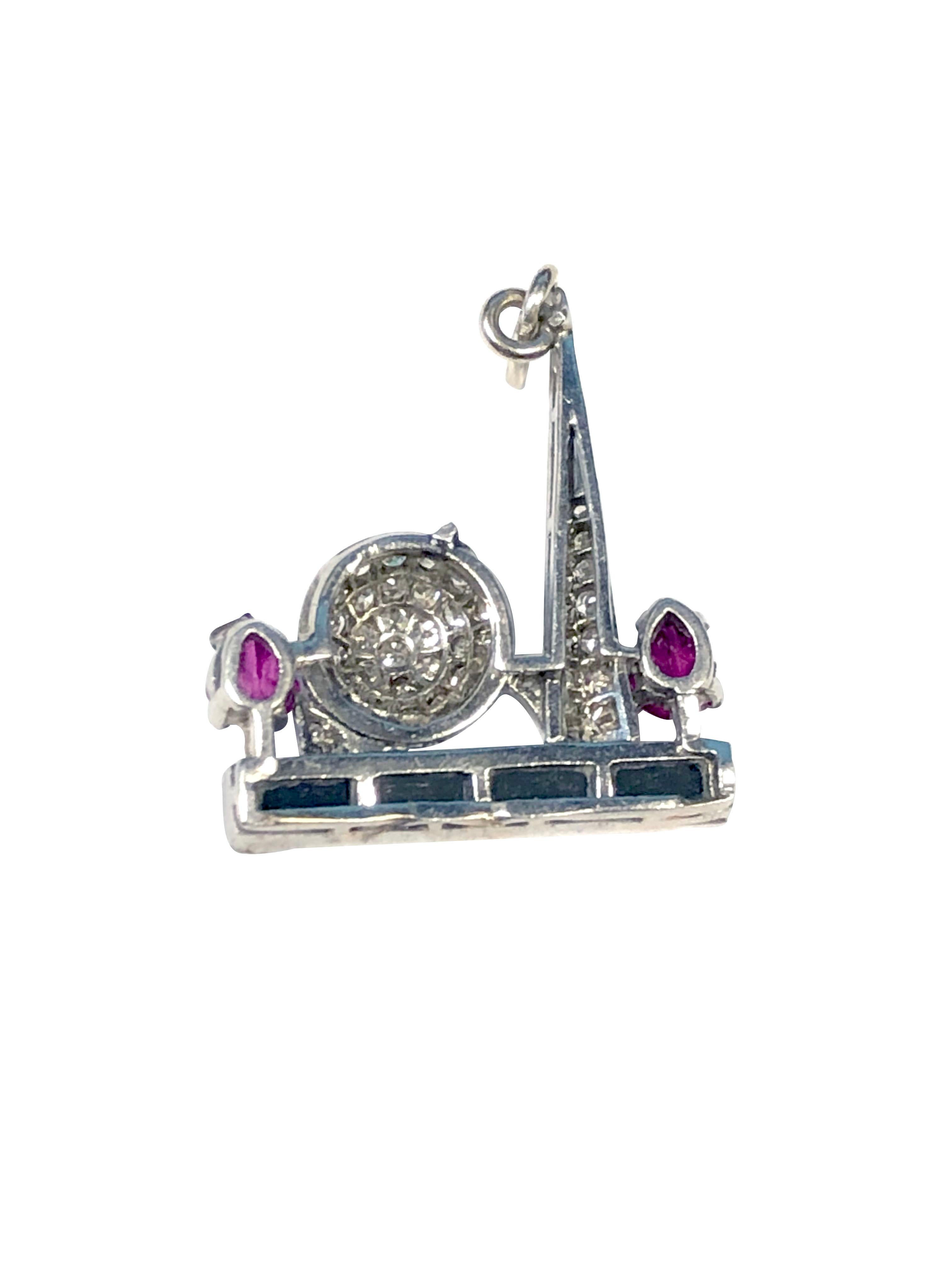Very Scarce Art Deco 1939 New York Worlds Fair Charm, featuring the famous Trylon and Perisphere the charm - Pendant measures 5/8 X 1 inch and is set with Diamonds, faceted Onyx and Carved Rubies. An extremely hard piece to find.