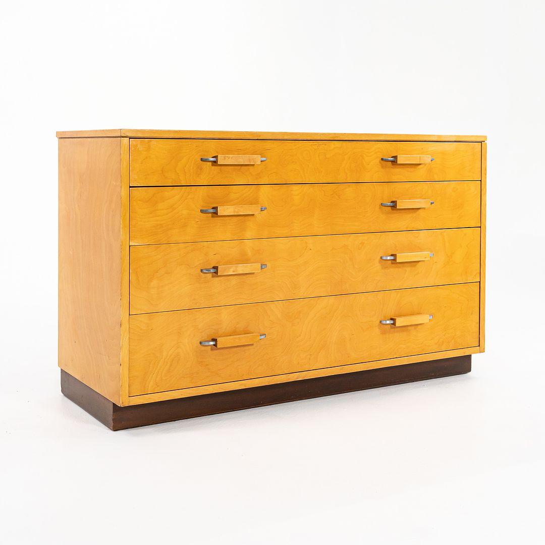 This is a birch dresser, designed by Eliel Saarinen, Eva-Lisa (Pipsan) Saarinen Swanson, and J. Robert F. Swanson in 1939. It was produced in Grand Rapids, Michigan by the Johnson Furniture Company. The piece features an exterior of Birch wood, and