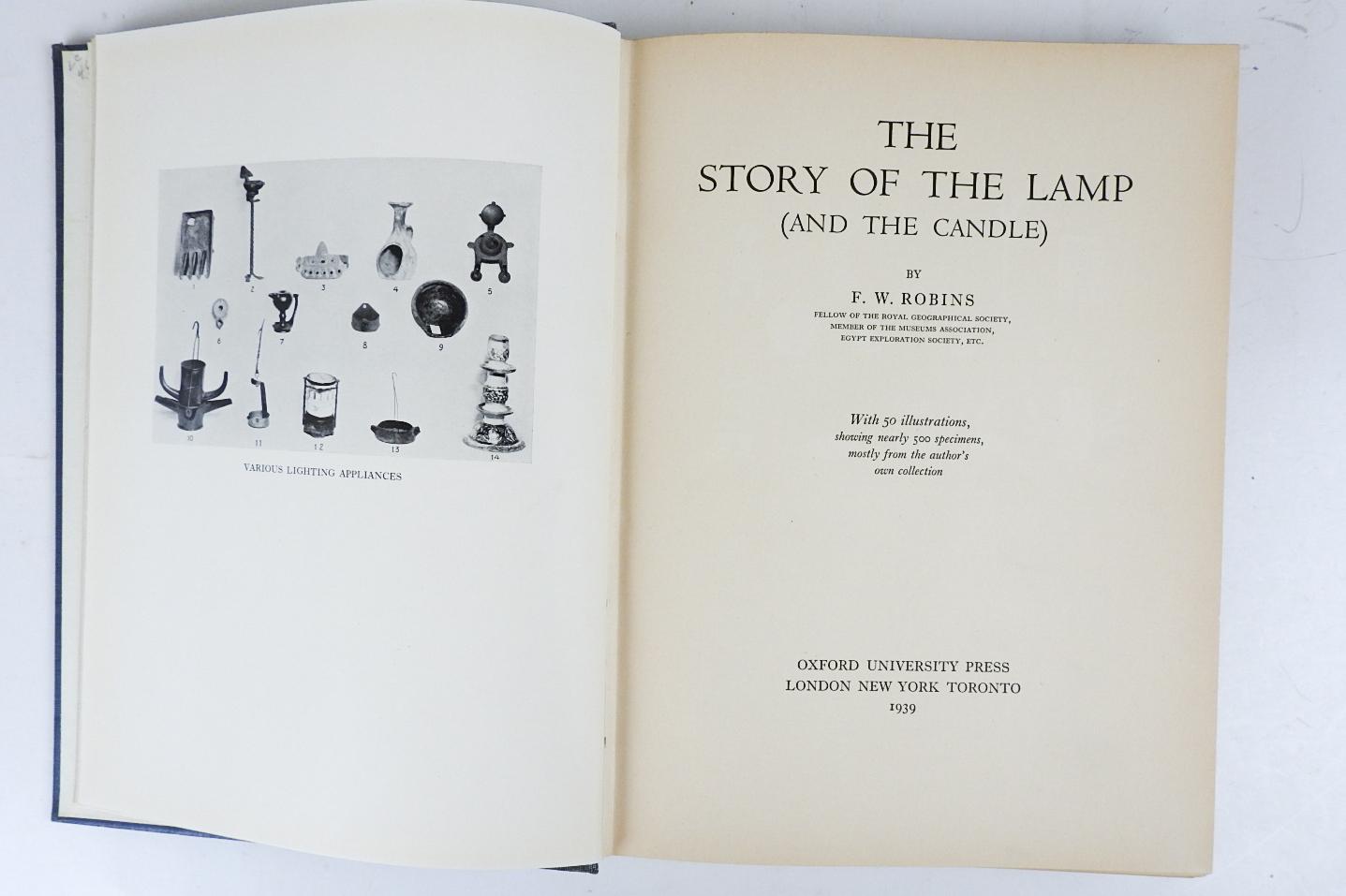 The Story Of The Lamp and the Candle by F. W. Robins.  Published by Oxford University Press, London, 1939.  Blue cloth binding, many black and white illustrations, shelf wear, exlib, age toning, spine fading.