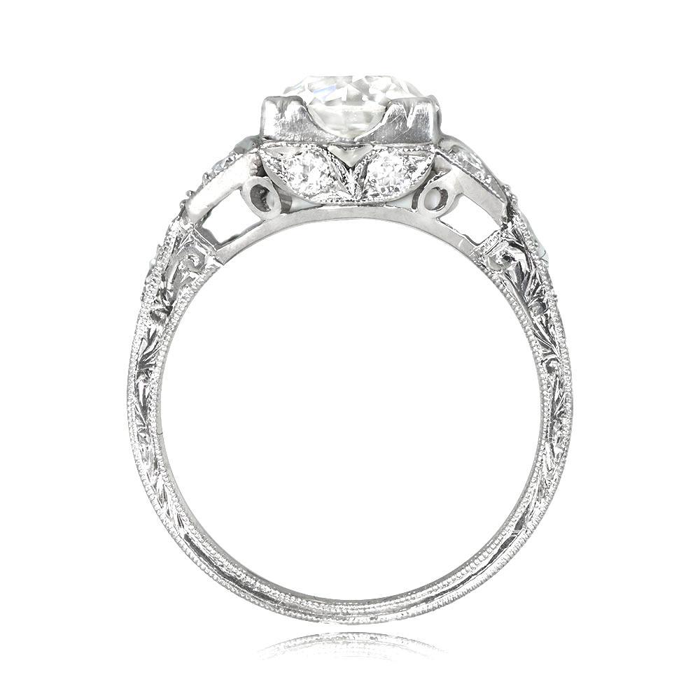 Narbonne ring flaunts a lively 1.93ct old European cut diamond (J, VS2) in prongs with bow motif diamonds on shoulders. The under-gallery features leaf-motif bezels with additional old European cut diamonds (0.52ct). Platinum handcrafted ring with