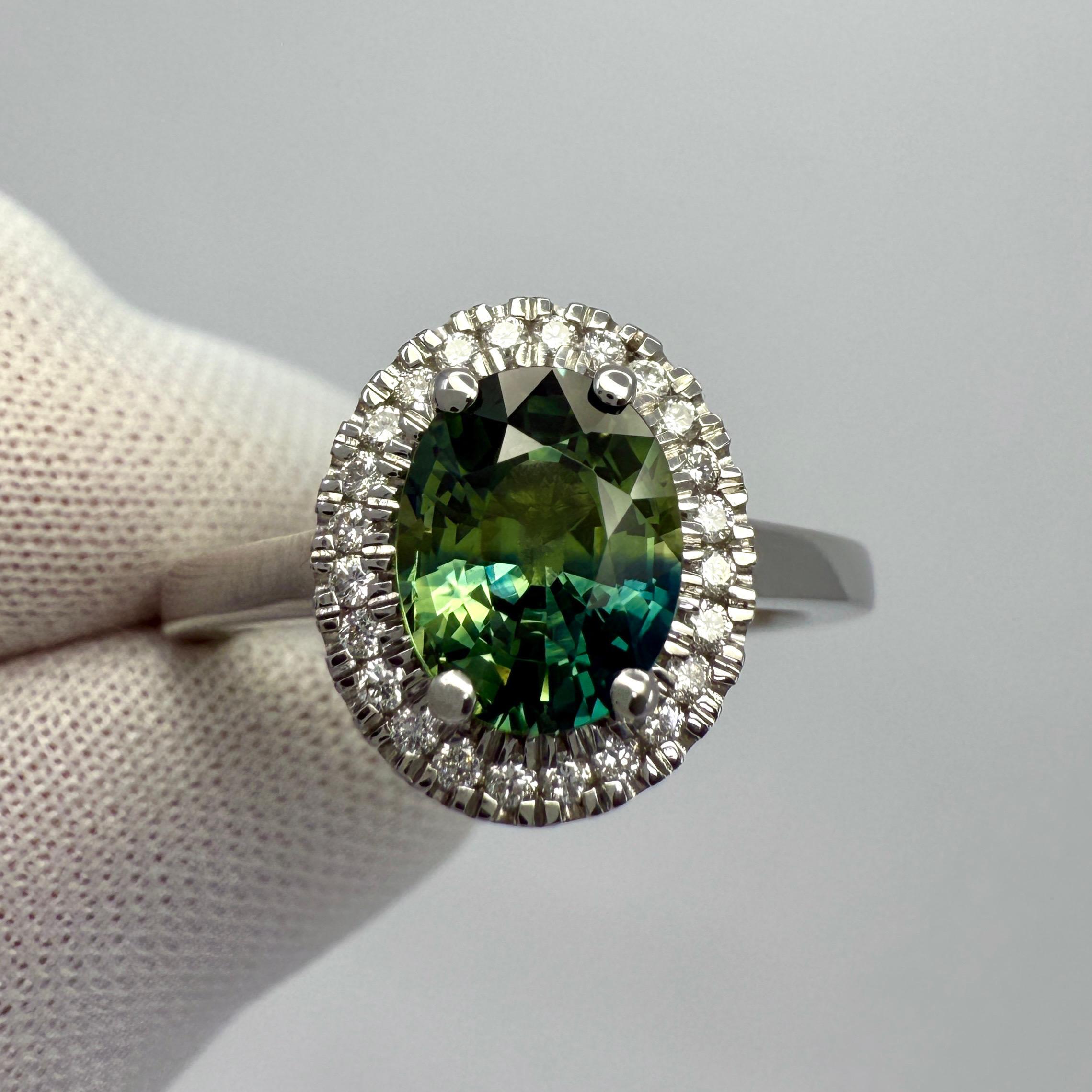 Unique Parti Colour Sapphire And Diamond Platinum Halo Ring. 1.93 Carat total.

This beautiful ring features a natural 1.78ct sapphire with a stunning blue and yellow green parti colour effect. Unique gemstone. This also has an excellent oval cut