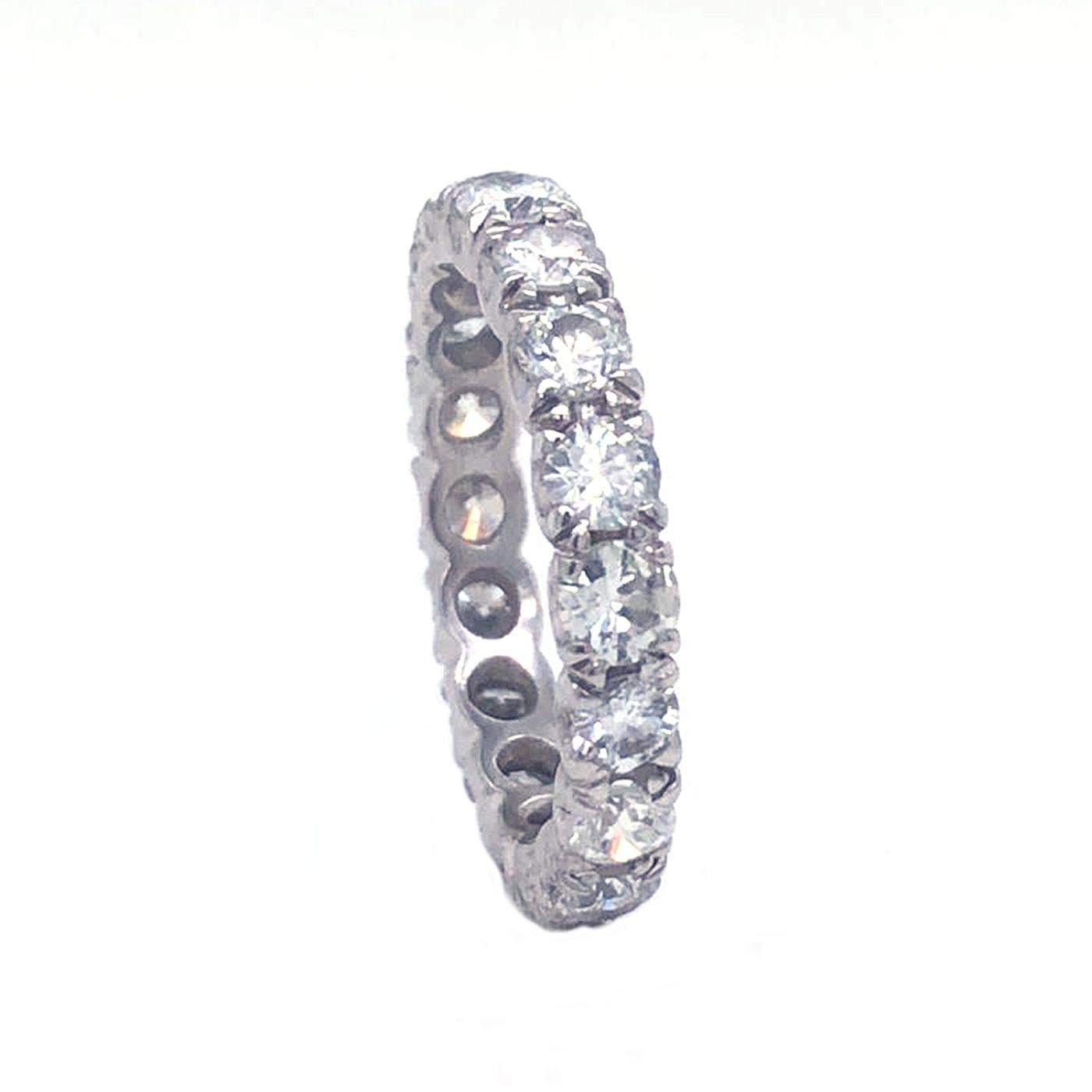 This gorgeous classic eternity band is perfect for everyone, This ring is made from 4.5 Grams of Platinum, 18 beautiful VS1, F Color diamonds totaling 1.93 Carats are sell all the way around the band for the perfect balance of Platinum to diamonds