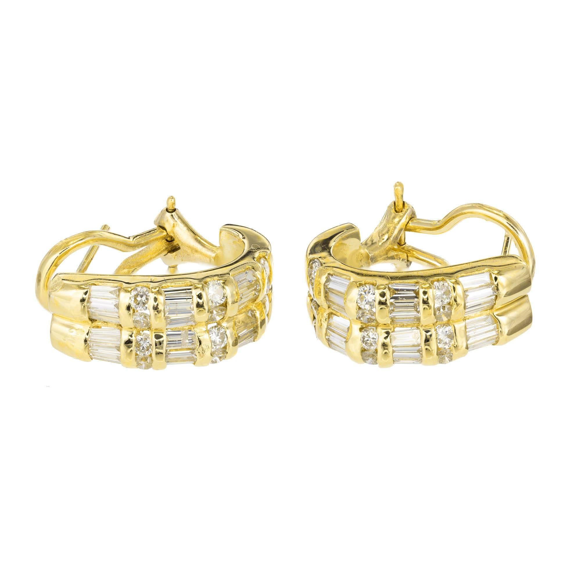 14k yellow gold diamond half hoop earrings. Earrings are set with six alternating rows of baguette cut and round brilliant cut diamonds which are all channel set. Earrings have a post with an omega clip back.

24 round G-H VS diamonds 1.8mm