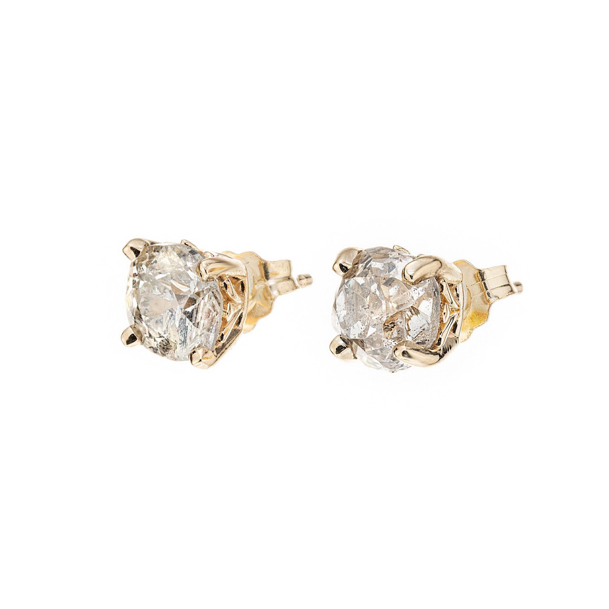 1820's Old mine cut diamond stud earrings. Faint yellow color L-M and eye visible flaws. Diamonds are from the 1820's with antique old world cutting style with raised crown and small table. The 14k yellow gold settings were recently created for the