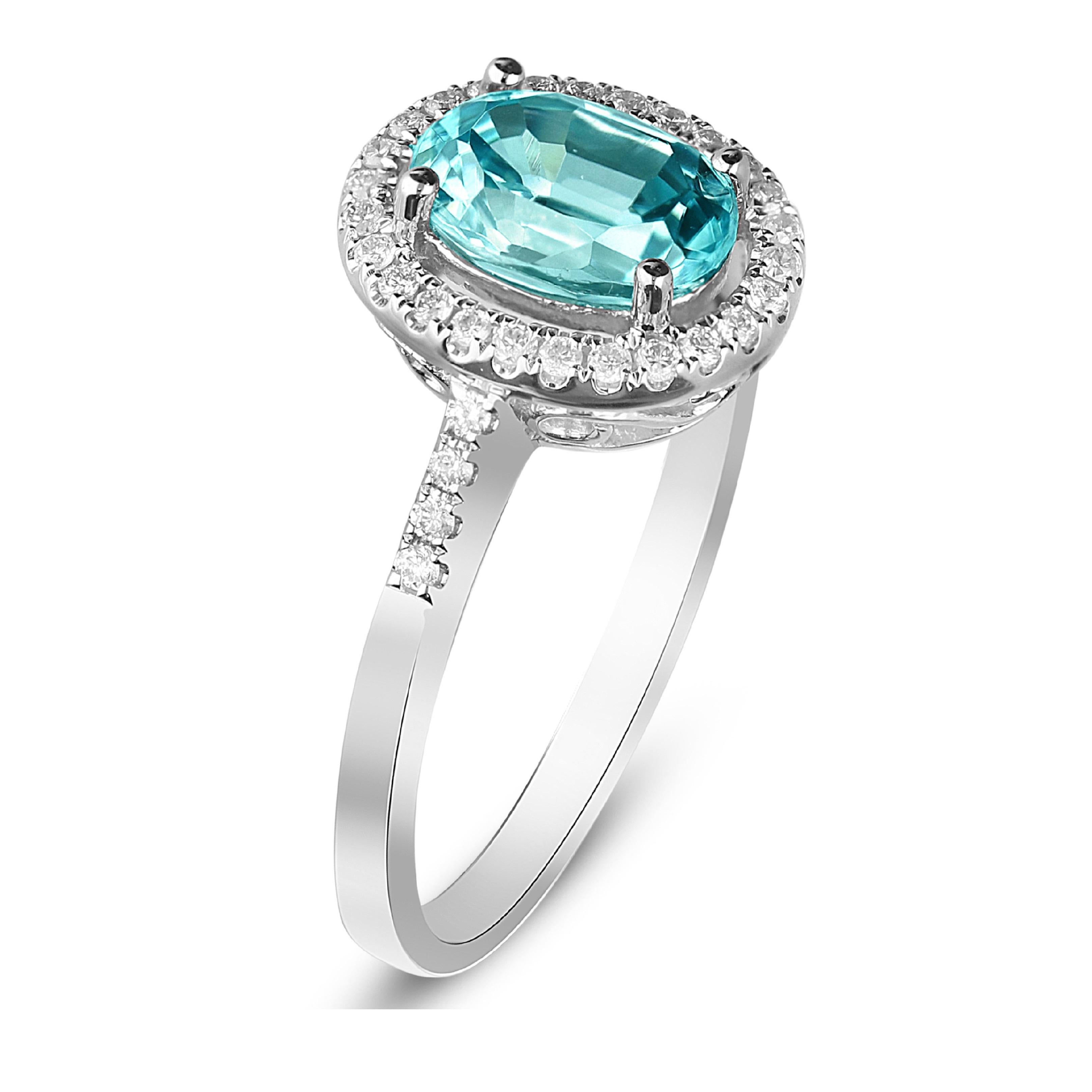 Decorate yourself in elegance with this Ring is crafted from 14-karat White Gold by Gin & Grace. This Ring is made up of 8x6 mm Oval-Cut (1 pcs) 1.94 carat Blue Zircon and Round-cut White Diamond (34 Pcs) 0.18 Carat. This Ring is weight 2.81 grams.