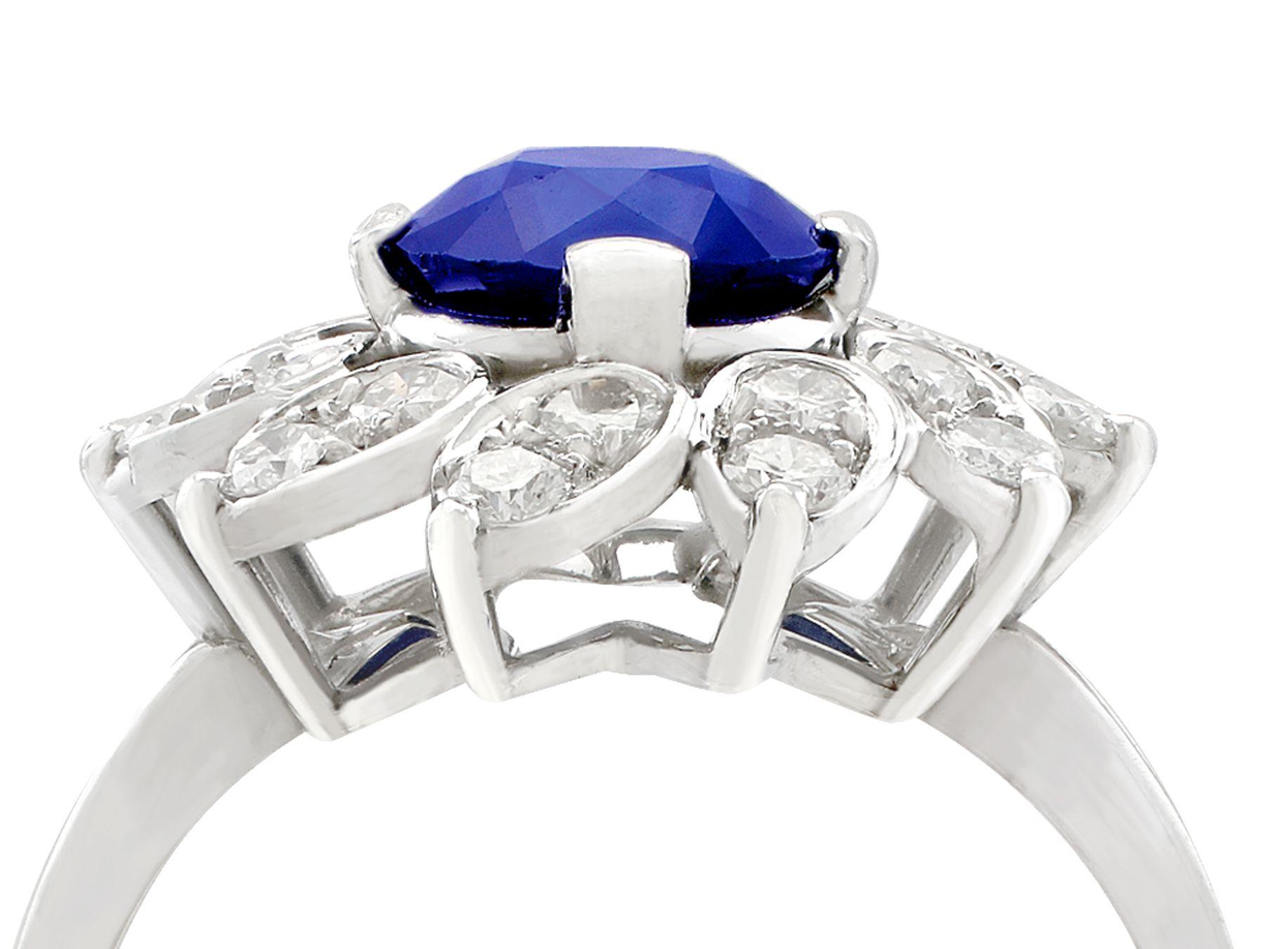 A stunning vintage 1970s 1.94 carat sapphire and 0.87 carat diamond, platinum cluster style dress ring; part of our diverse antique jewelry and estate jewelry collections.

This stunning, fine and impressive 1970s sapphire and diamond cluster ring