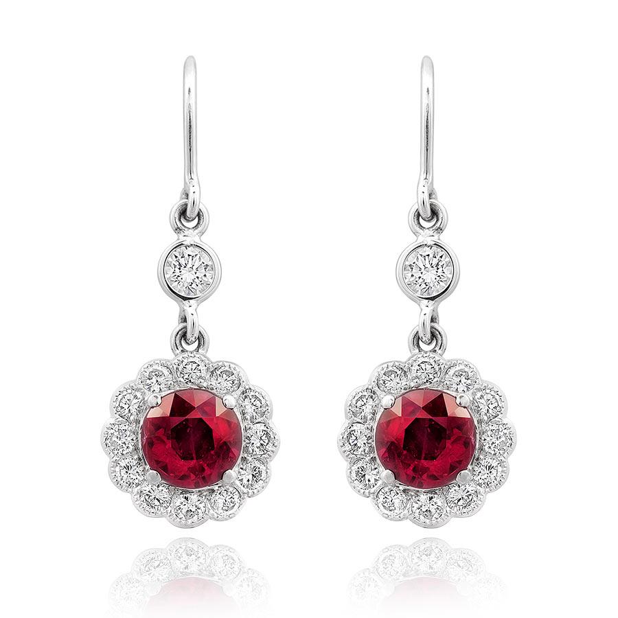 These stunning natural Ruby earrings with The Gem and Jewelry Institute of Thailand Report are clustered with radiant diamonds in a floret-style setting, allowing the total 1.94 carats of stones to make a statement before you ever have to say a