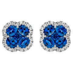 Clous d'oreilles halo de saphirs bleus de forme mixte et de diamants ronds de 1,94 carat au total