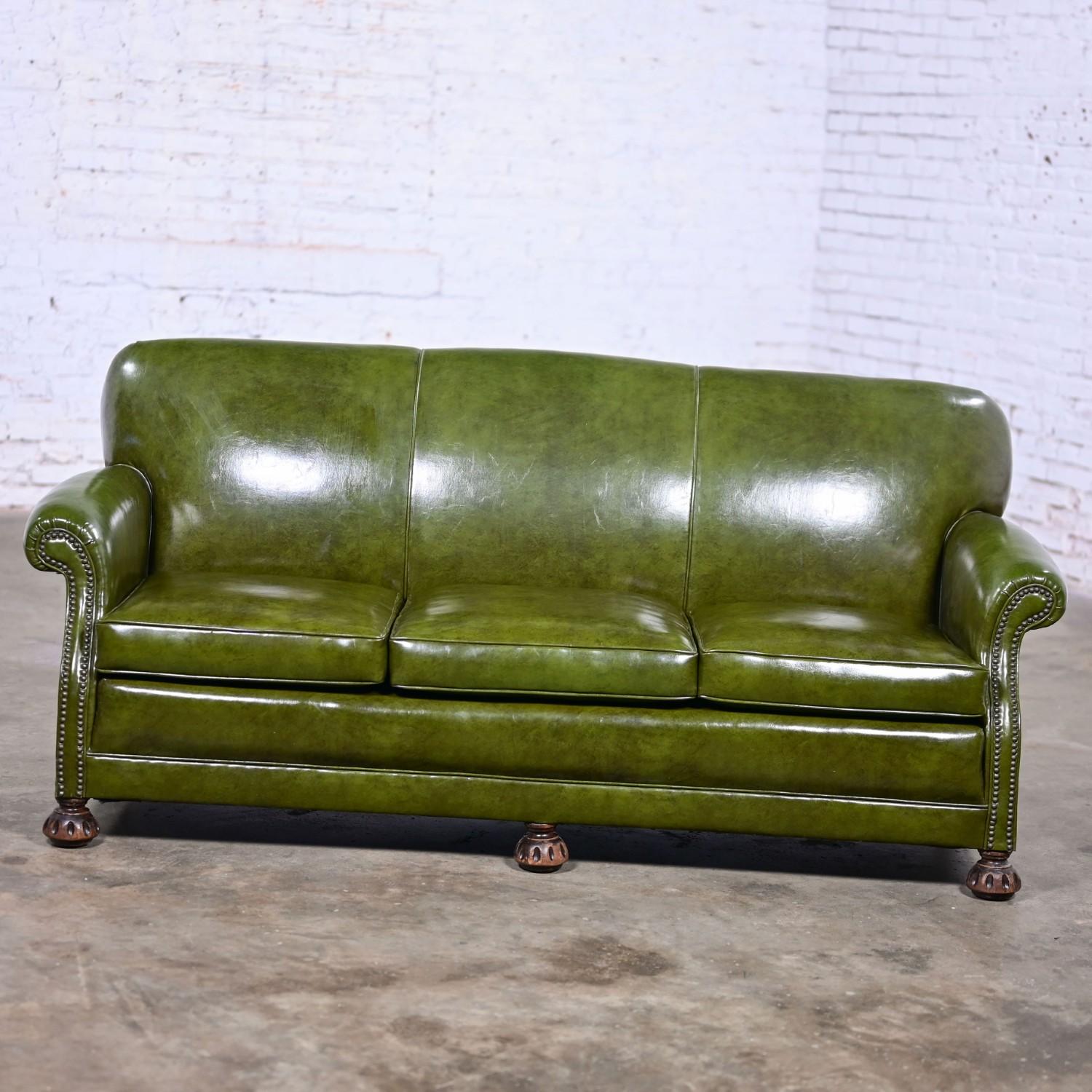Handsome vintage Traditional green Naugahyde faux leather Lawson style club or library sofa with rolled arms by Vargas Fine Furniture. Beautiful condition, keeping in mind that this is vintage and not new so will have signs of use and wear even if