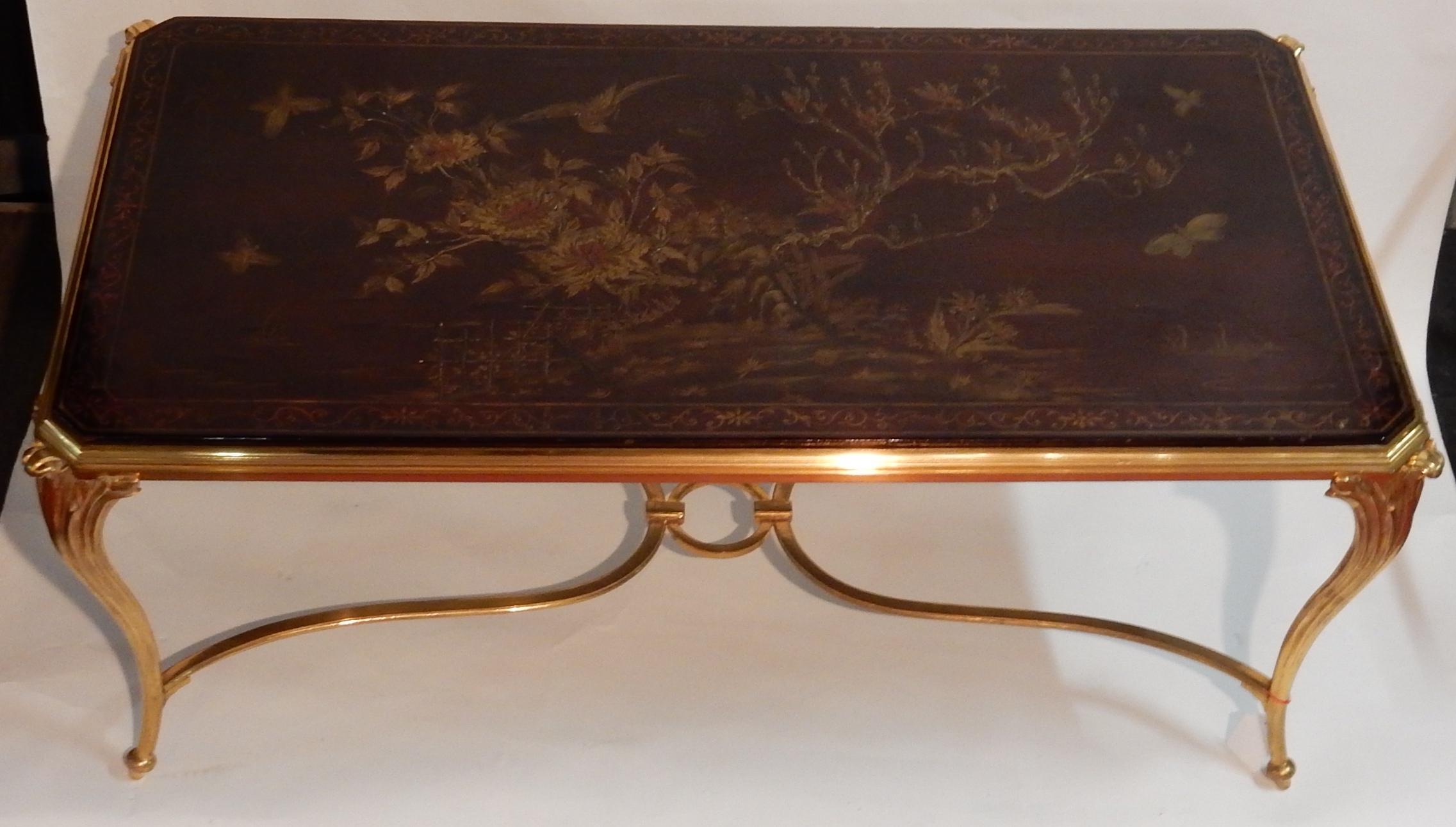 Coffee table in gilded bronze, top lacquer of china has decoration, bird, butterfly, the low part is shown solidarity by a spacer with circle in its center.
Everything is demountable easier for packaging shipping,
circa 1940-1950, good condition.