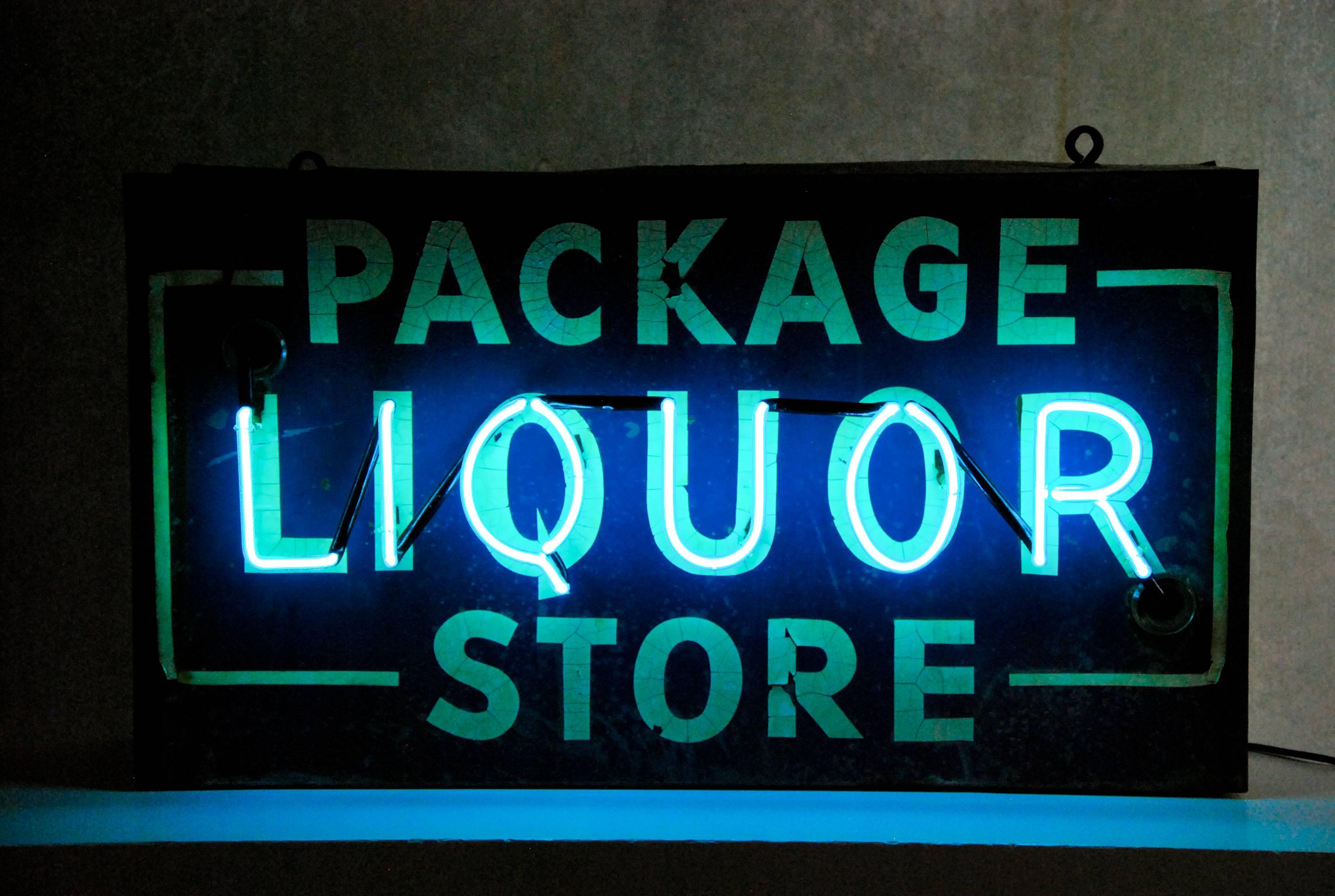 Original to sided neon sign showing the package Liquor store.
Rewired and neon redone. Beautiful small working neon sign.

In various parts of the country, retail stores that sell liquor are called by all sorts of different names. When they need
