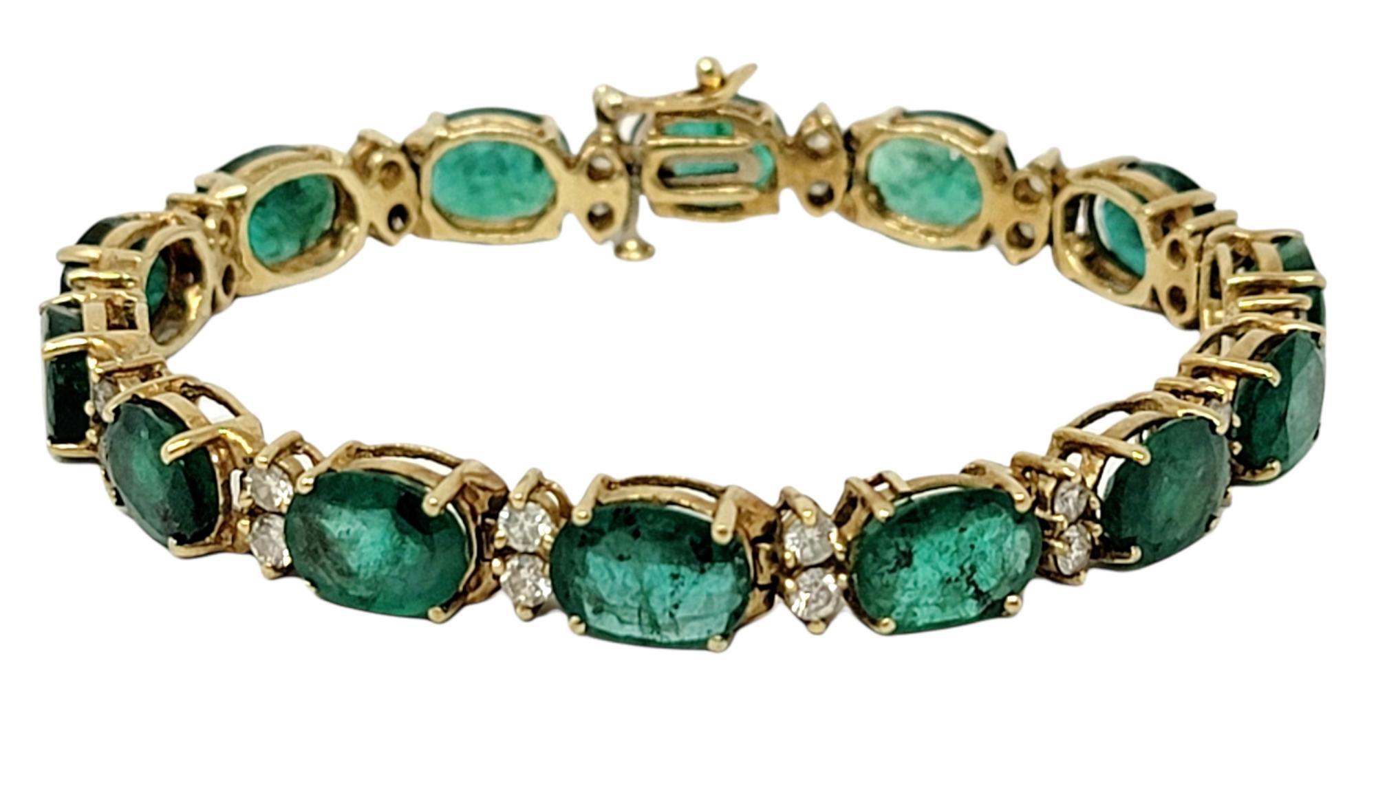 Breathtaking emerald and diamond line bracelet in 14 karat yellow gold. This absolutely gorgeous bracelet features an impressive 18.00 carats total of sparkling natural emerald stones, bright green in color. The 14 sizeable oval mixed cut stones are