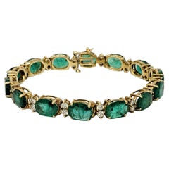 Vintage 19.40 Carats Oval Mixed Cut Emerald and Diamond Line Bracelet in 14 Karat Gold