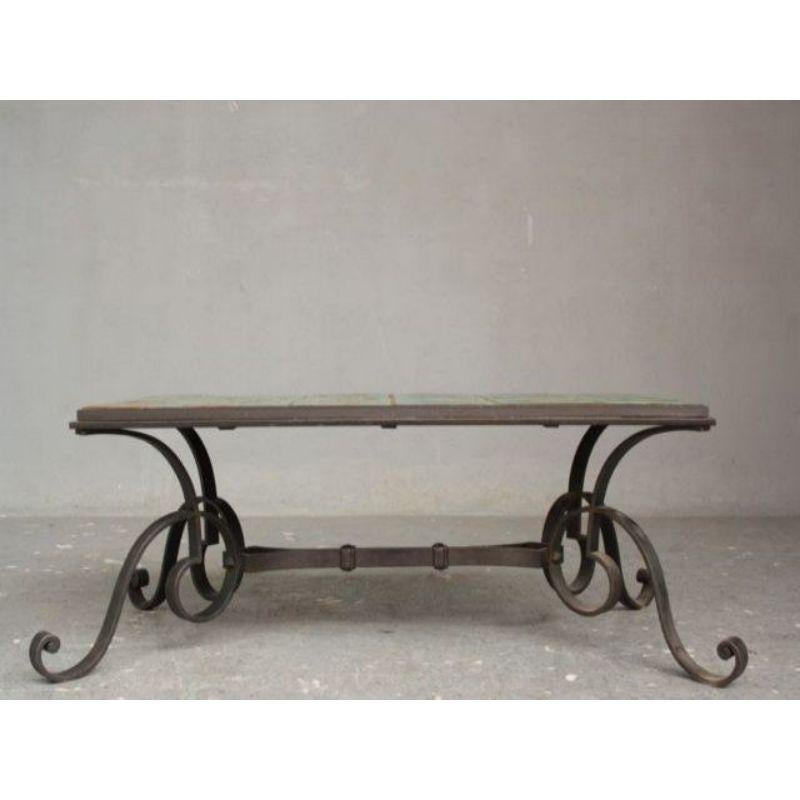 French work coffee table from the 1940s in wrought iron and ceramic, height 47 cm, length 135 cm and depth 70 cm.

Additional information:
Style: 40s 60s
Material: Metal & Wrought iron.