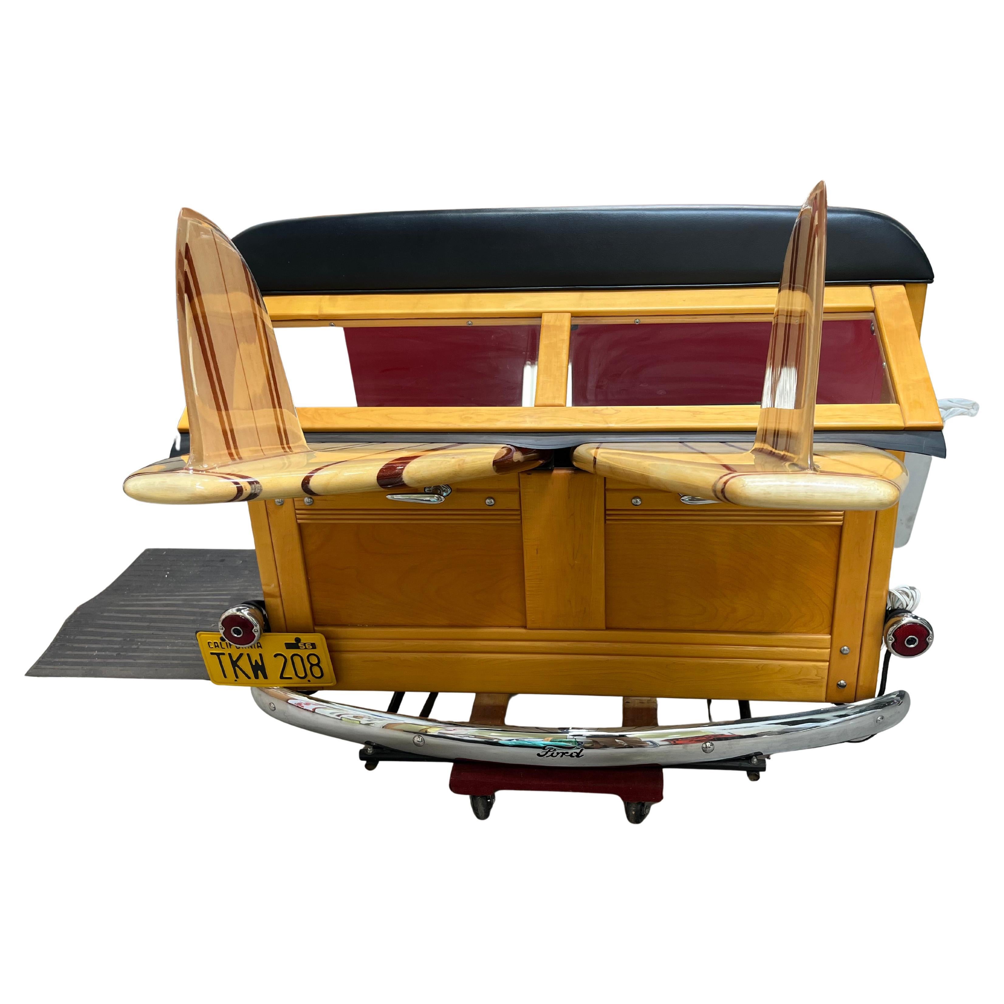 Beautifully detailed 1940 Ford Woody replica display featuring two vintage balsawood 1960s longboards. Functional tail lights/FORD emblem center light. Rare example of a custom made 1940s Woody surfboard display piece! 