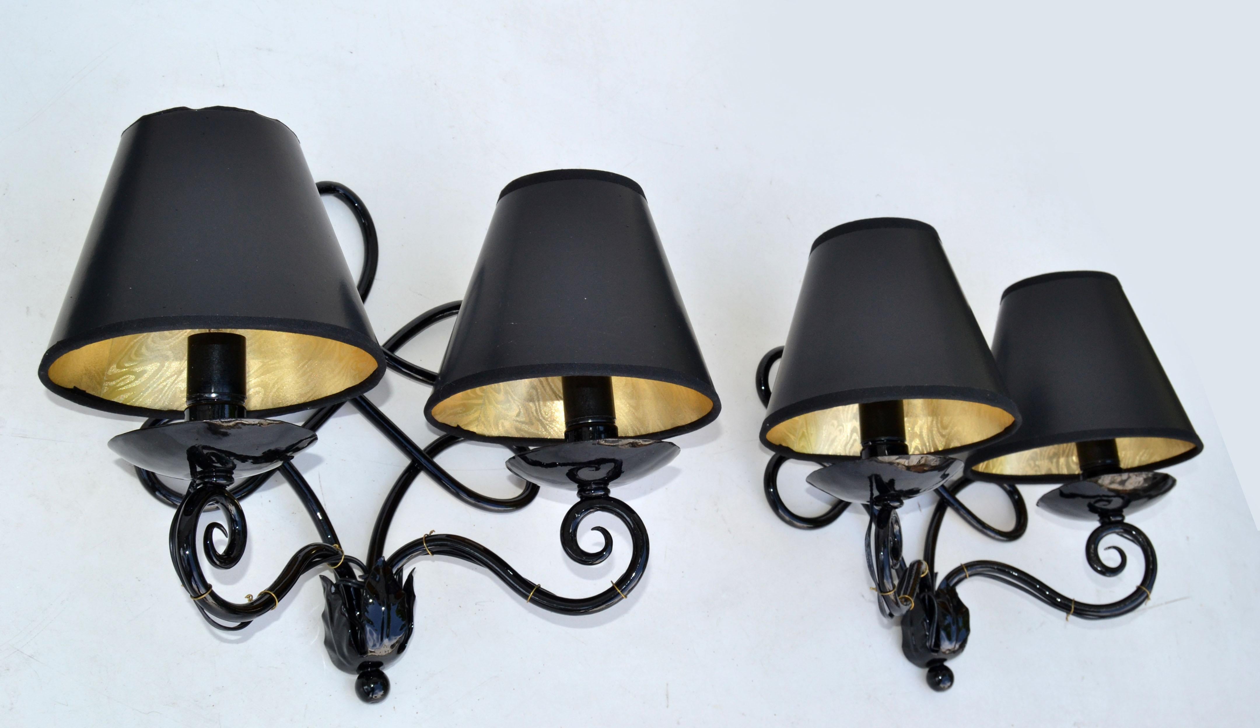 Art Deco Pair of Wrought Iron 2 Light Sconces, Wall Lamps powder-coated in Black Gloss Finish.
Made in France circa 1940.
US Rewiring and each Sconces takes 2 candelabra Light Bulbs with max. 40 watts.
Custom made Junction Box Back Plate