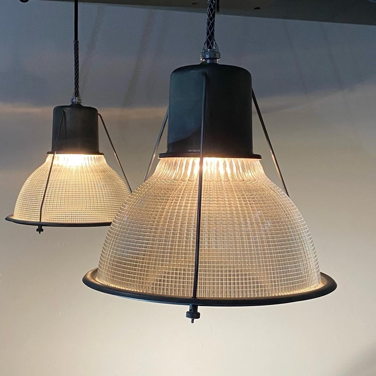 A set of 10 industrial lights with shielded bulb portion, not common in salvaged holophane fixtures. The glass is also double folded to allow for a diffuse light with incredible reflections.
Authentic and original glass and steel Holophane