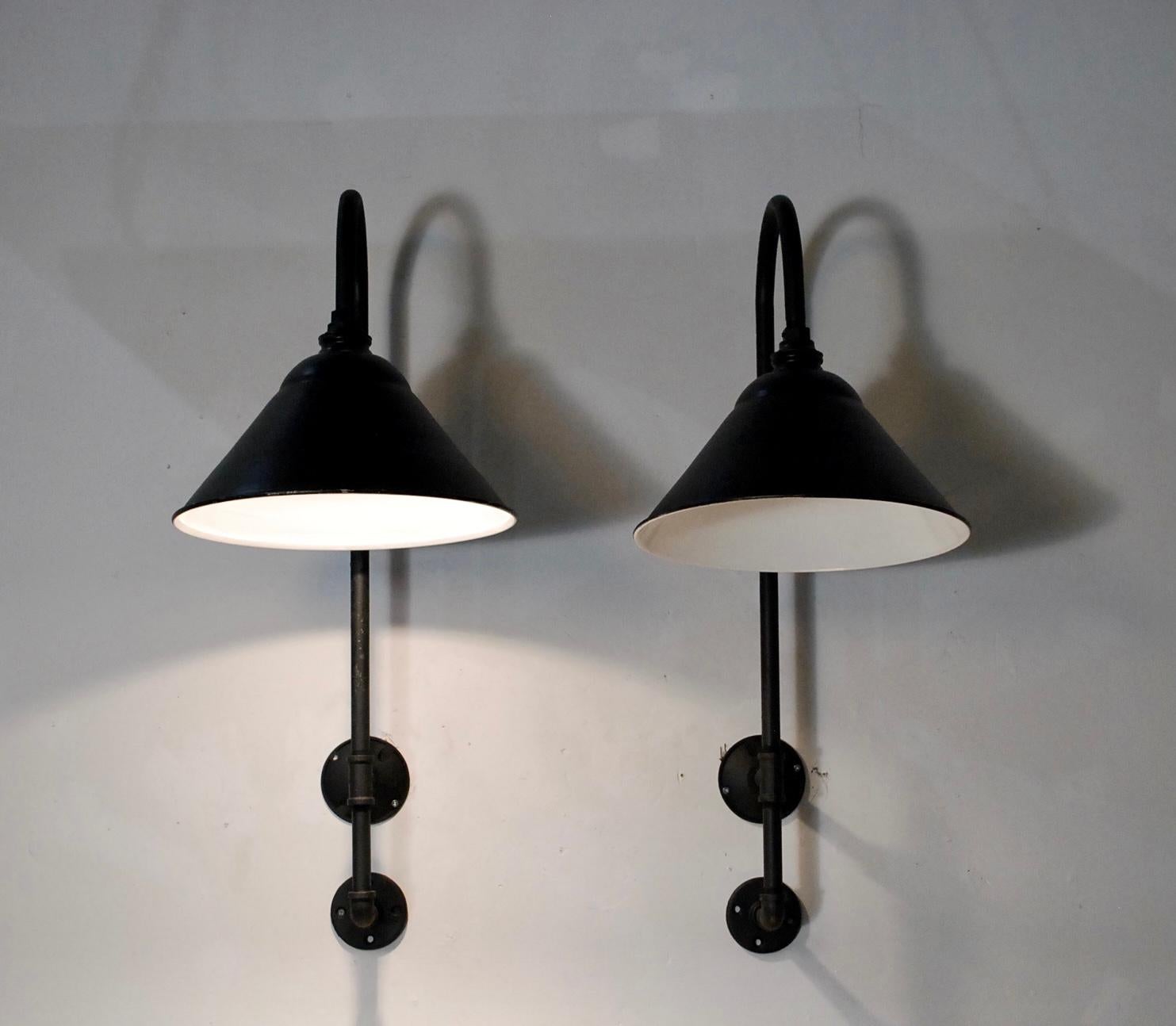 We have a set of 4 of these black enamel sconces mounted on pipe, made by Benjamin electric co., rewired tested and CSA certified.
Ready to go. Indoor or outdoor covered area.

Price per light.