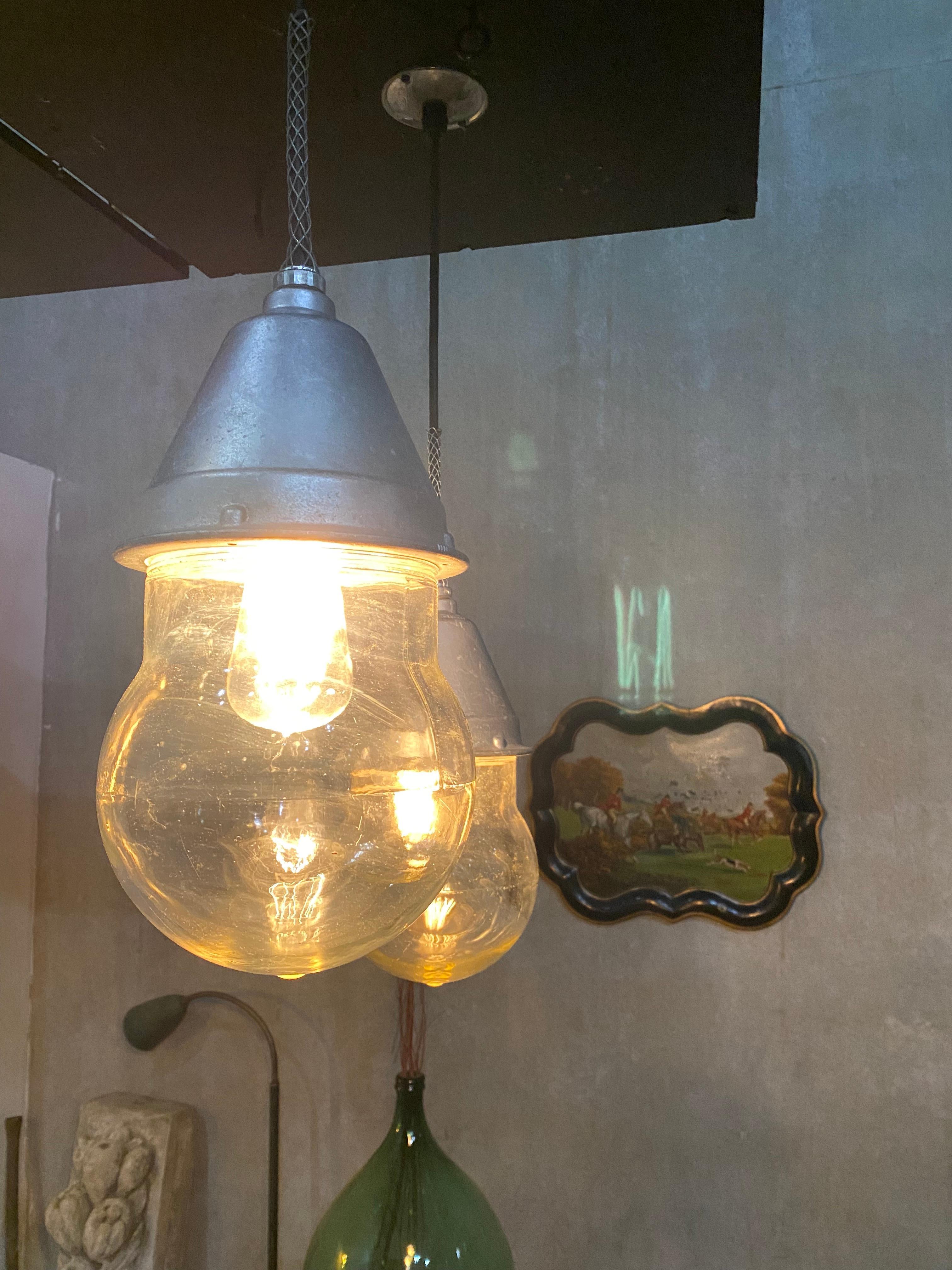We have 6 Oversized fully working Crouse hinds lights rewired and csa tested , with full heavy glass globes. A statement in industrial pendant form.
A tough find to get 6 in working condition.
Priced per light.