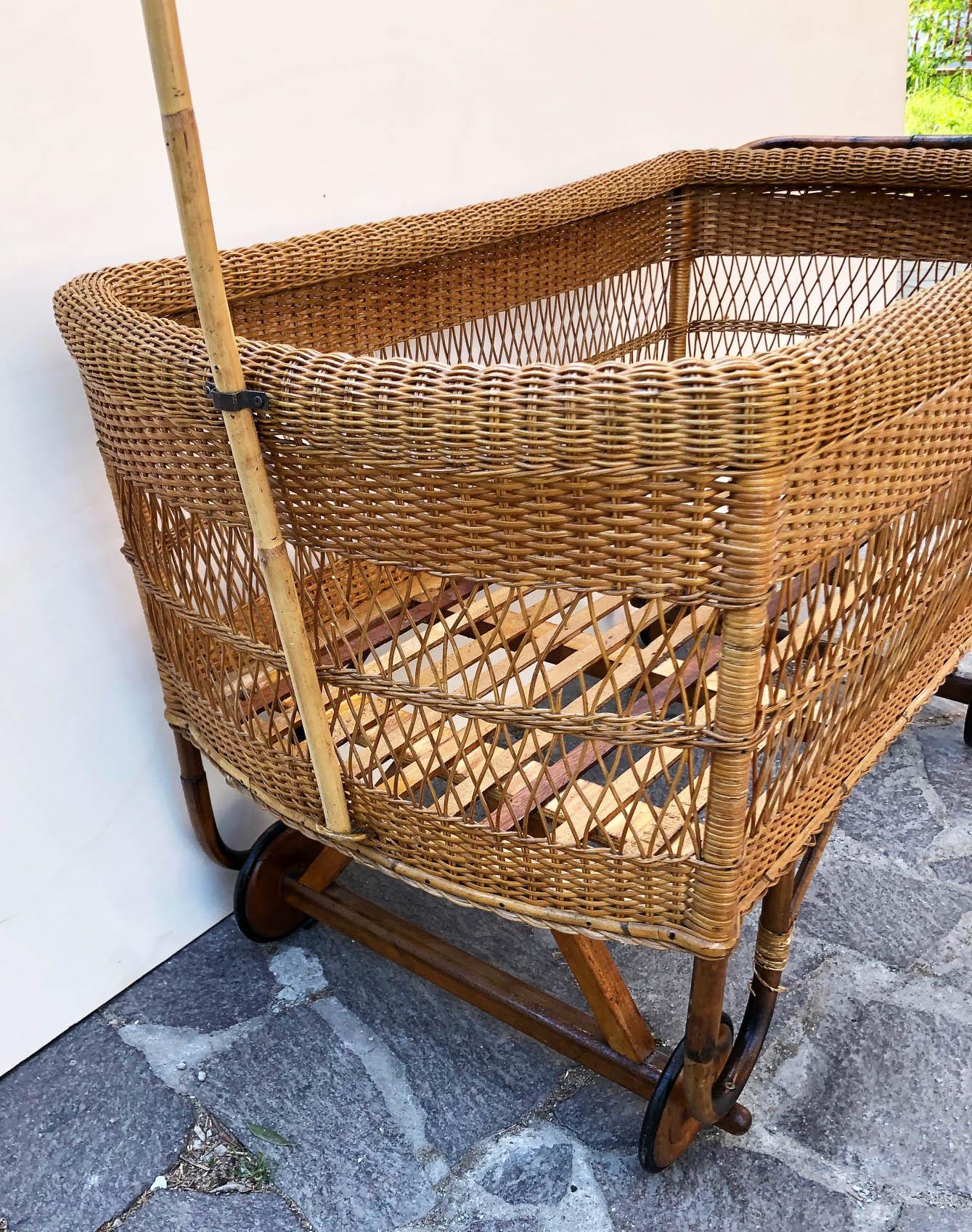 Mid-20th Century 1940 Italian Hand-Woven Wicker Crib, Wooden Wheels, with Original Cover