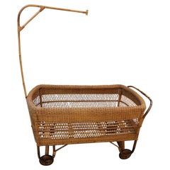 Used 1940 Italian Hand-Woven Wicker Crib, Wooden Wheels, with Original Cover