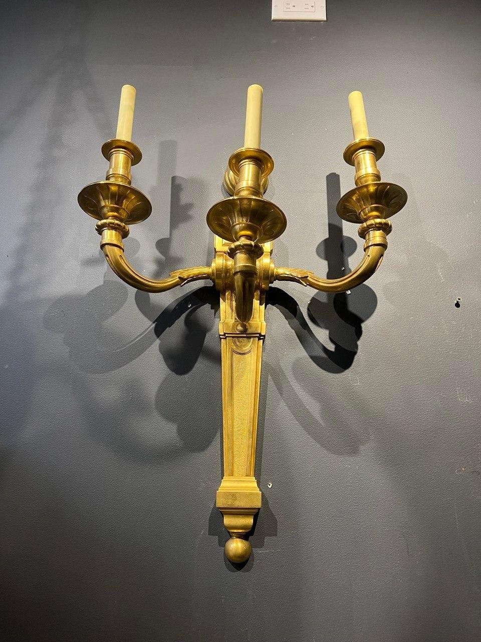 A pair of circa 1940’s gilt bronze sconces with 3 lights very unusual big size 