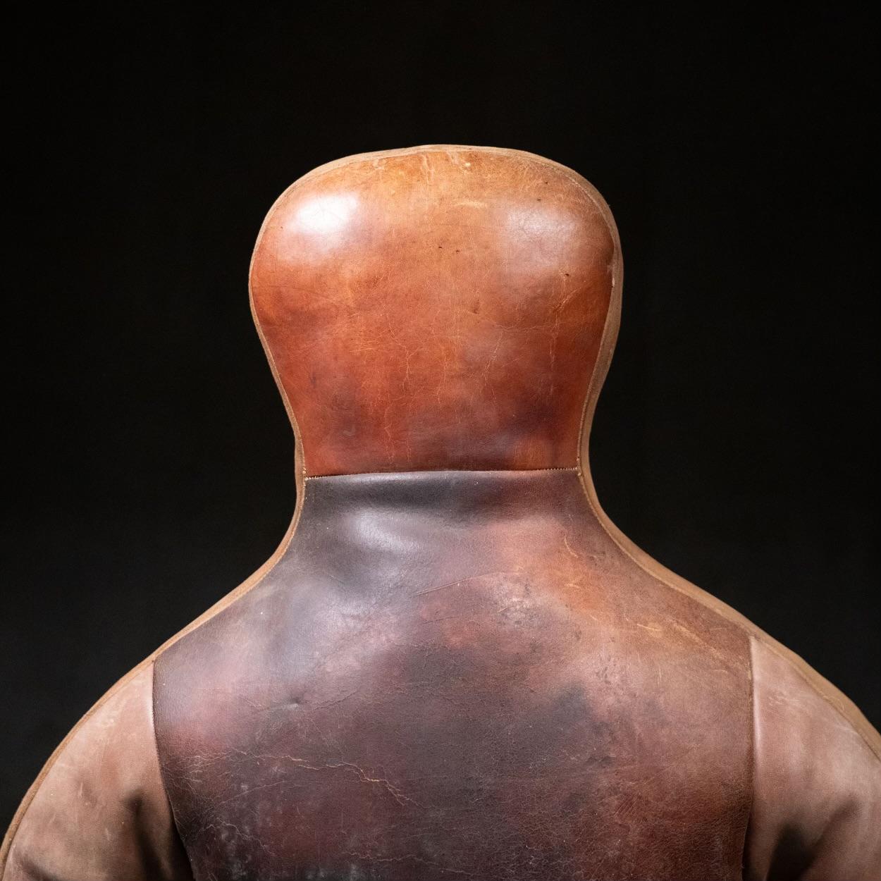 A very good example of a quality leather dummy used for wrestling practice .. excellent patina  with custom stand for display …excellent piece of sports artifact 