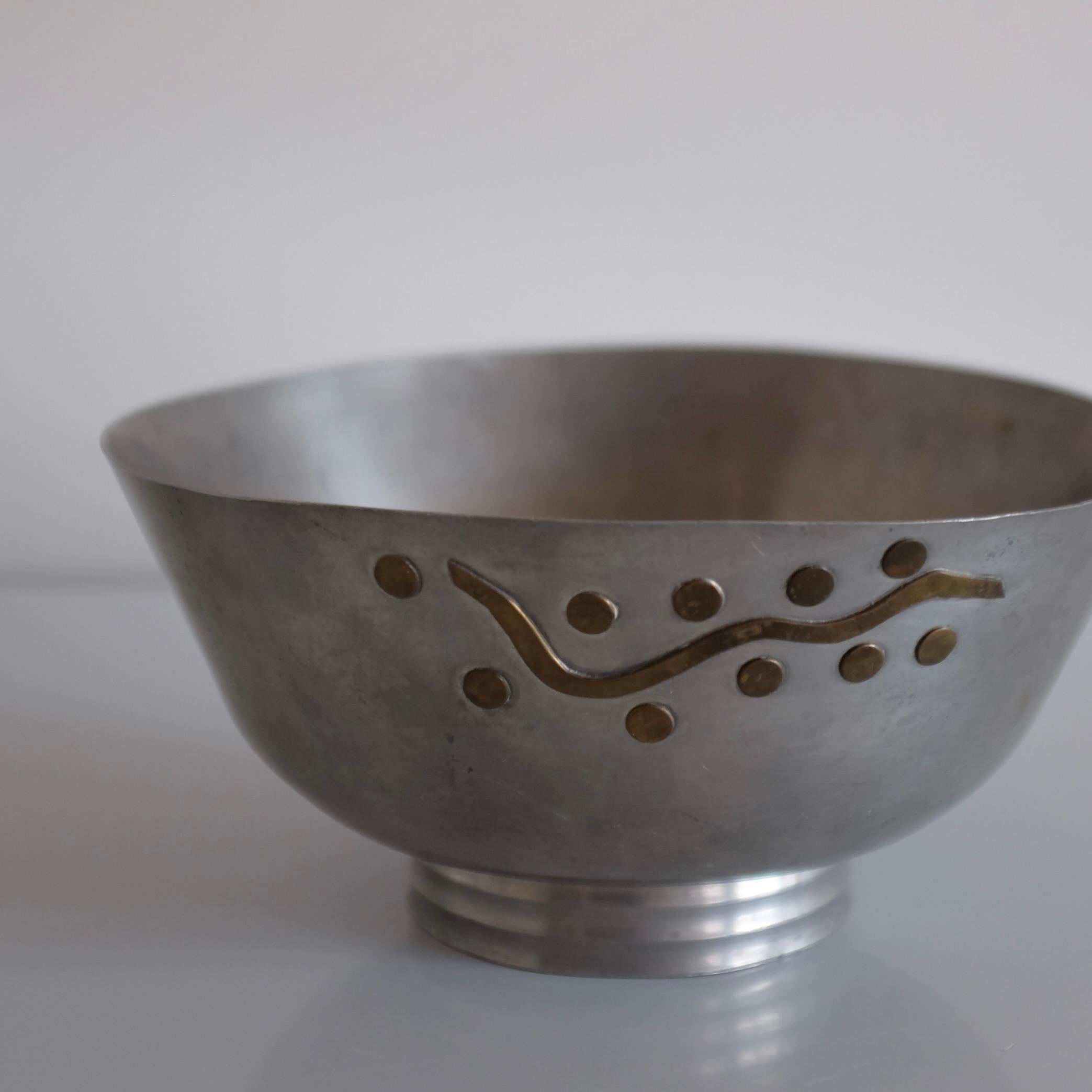 Beautiful Pewter bowl by Mabos with Brass details in an organic pattern. Mabos was associated with Firma Svenskt Tenn in the early days when Estrid Ericson founded the design company. Mabos manufactured high quality pewter items that was sold via
