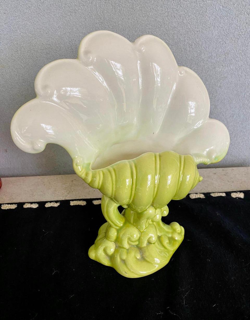Beautiful 1940’s Royal Haeger vase Number R 483 USA Designed by Hickman. Vase is a flowing seashell form, decorated in a lime green color with a white interior. t's a large vase with beautiful details 