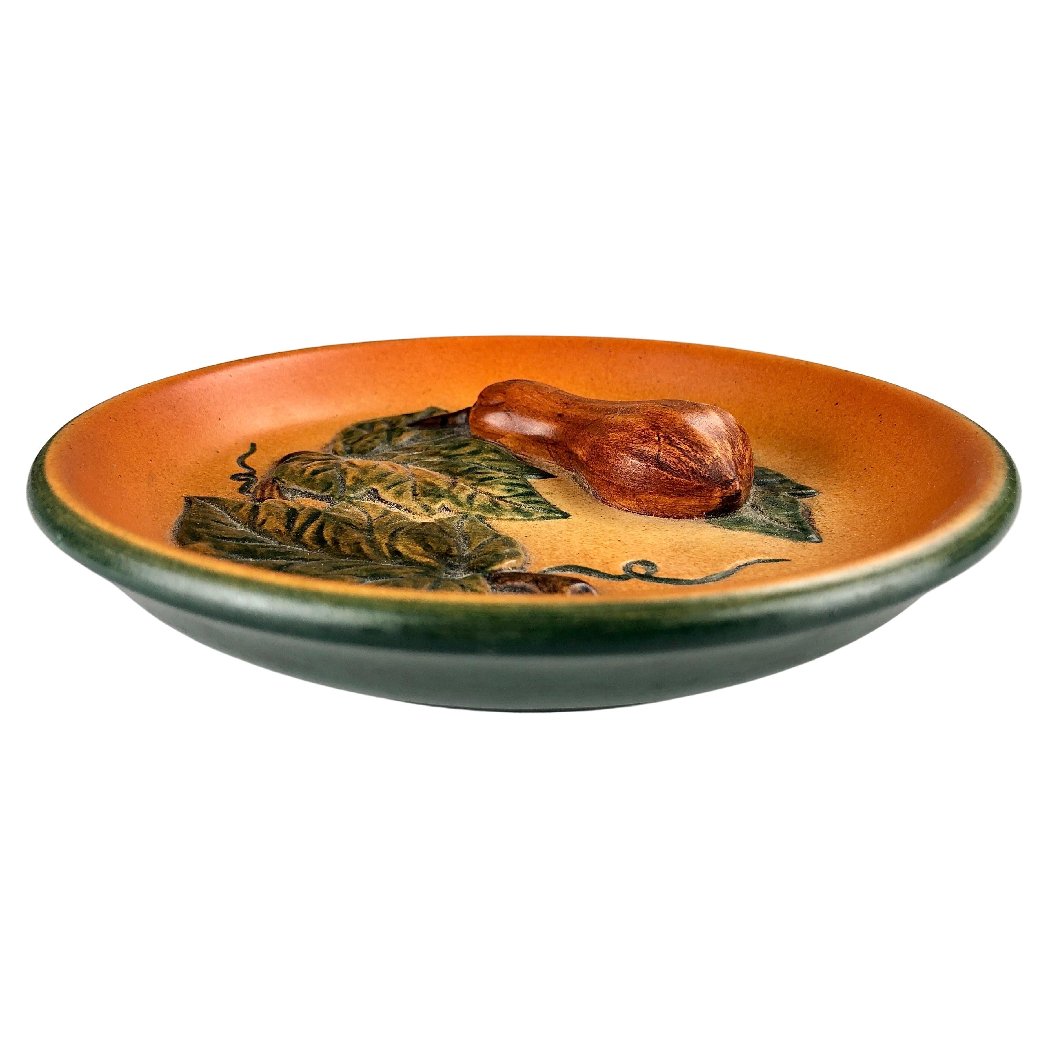 Danish platter / ash tray by Axel Sørensen for P. Ipsens Enke 1941

The platter / ash tray that feature a well made lively colorfull old cucumber is in very good vintage condition.

Ipsens Enke (1843 - 1955) was a very succesfull company that