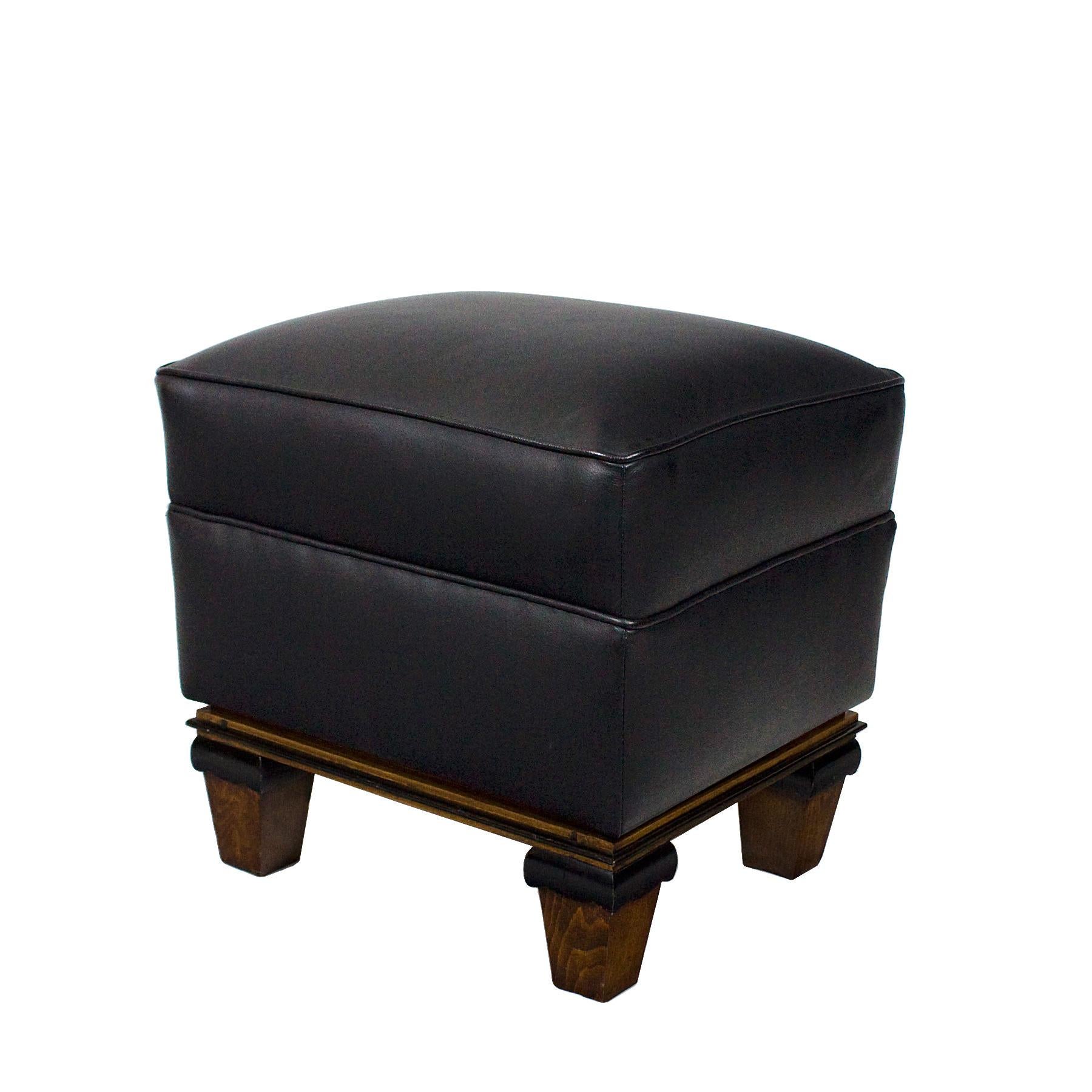 Four feet stool, beach wood and stained beechwood, black leather new upholstery.

France circa 1940.