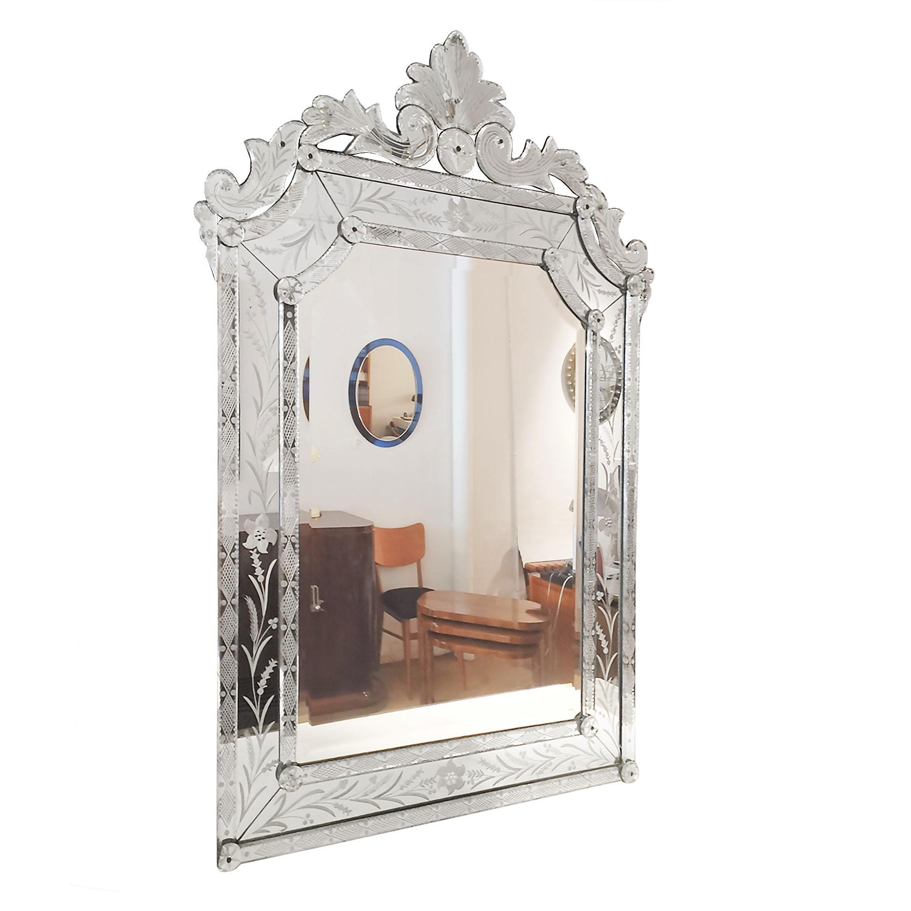 Neoclassical beveled mirror with carved and acid engraved mirror frame, floral and vegetal patterns (Some missing glass screw heads),

Spain, Majorca, circa 1940.
