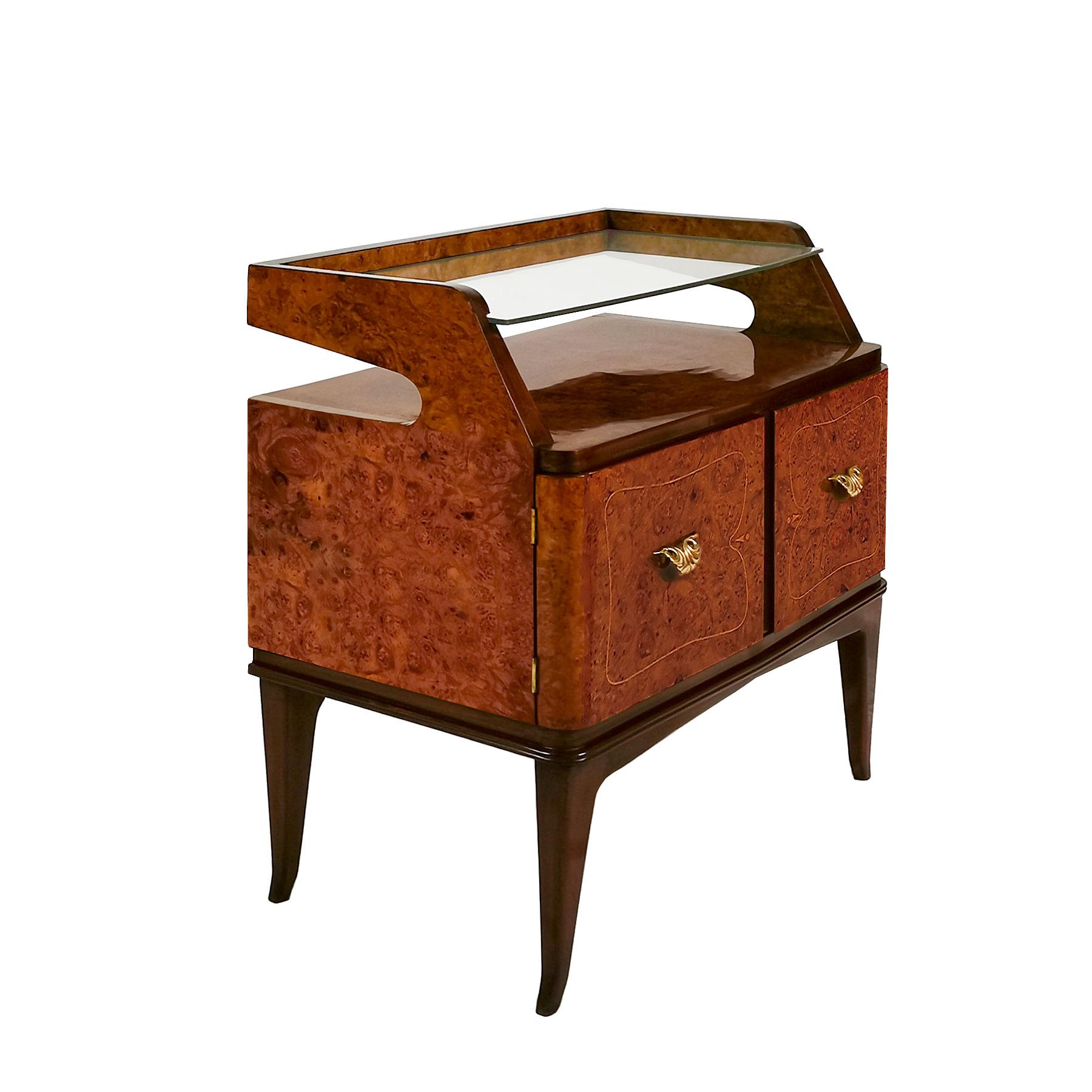 Pair of nightstands in solid and stained walnut, burr walnut veneer with a boxwood frieze, French polish. Polished brass handles and hinges, thick originals glasses on top.

Italy, circa 1940.