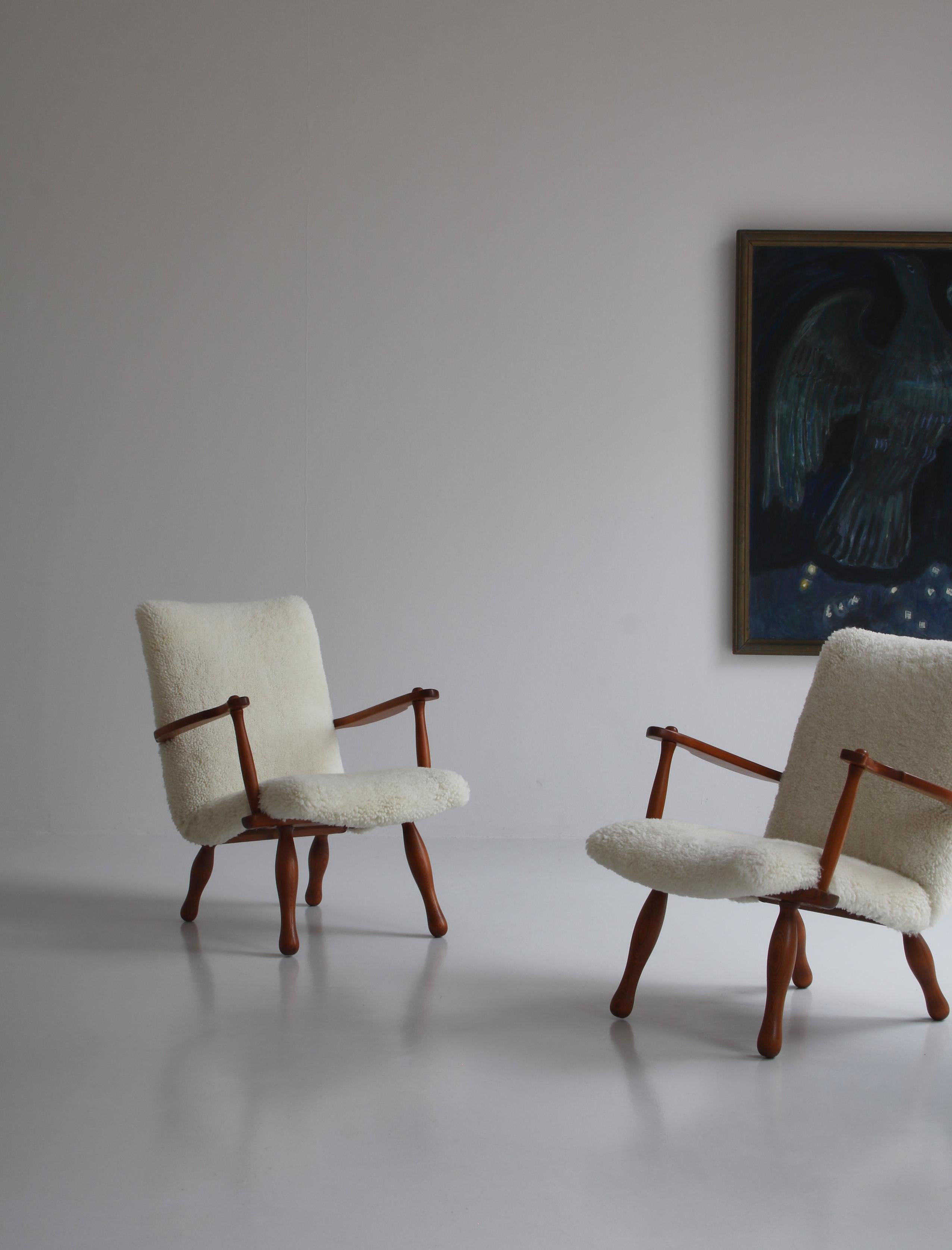An amazing and rare pair of original lounge chairs made in Sweden in the 1940s in the typical Swedish 