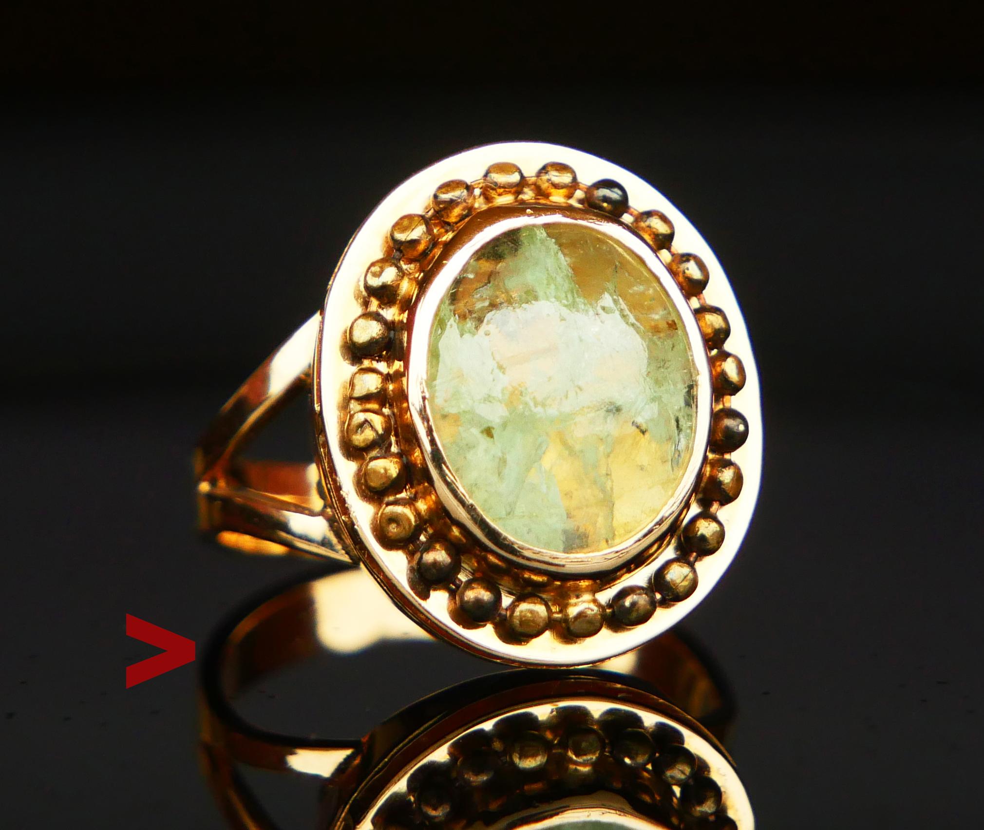 Beautiful Ring for the female hand. Made of solid 18K Yellow Gold. Bezel set cabochon of natural Heliodor / greenish-yellow shades variety of Beryl measuring about 11mm x 9 mm x 6mm deep / about 4 ct. The stone has natural flaws and inclusions.