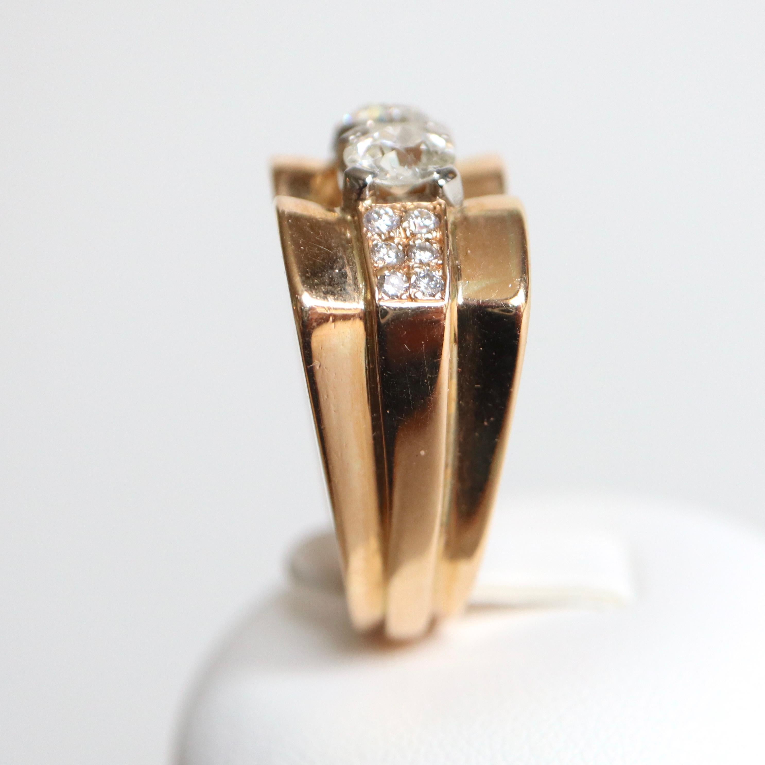 1940 Signet Ring in 18 Carat yellow Gold Tank Model, setting two main Diamonds of approximately 0.5 Carats each and a paving of 6 small Diamonds on each Side for approximately 0.2 Carats
Gross Weight: 14.3 g Diameter: 17 Size 53, US Size 6.5 Width
