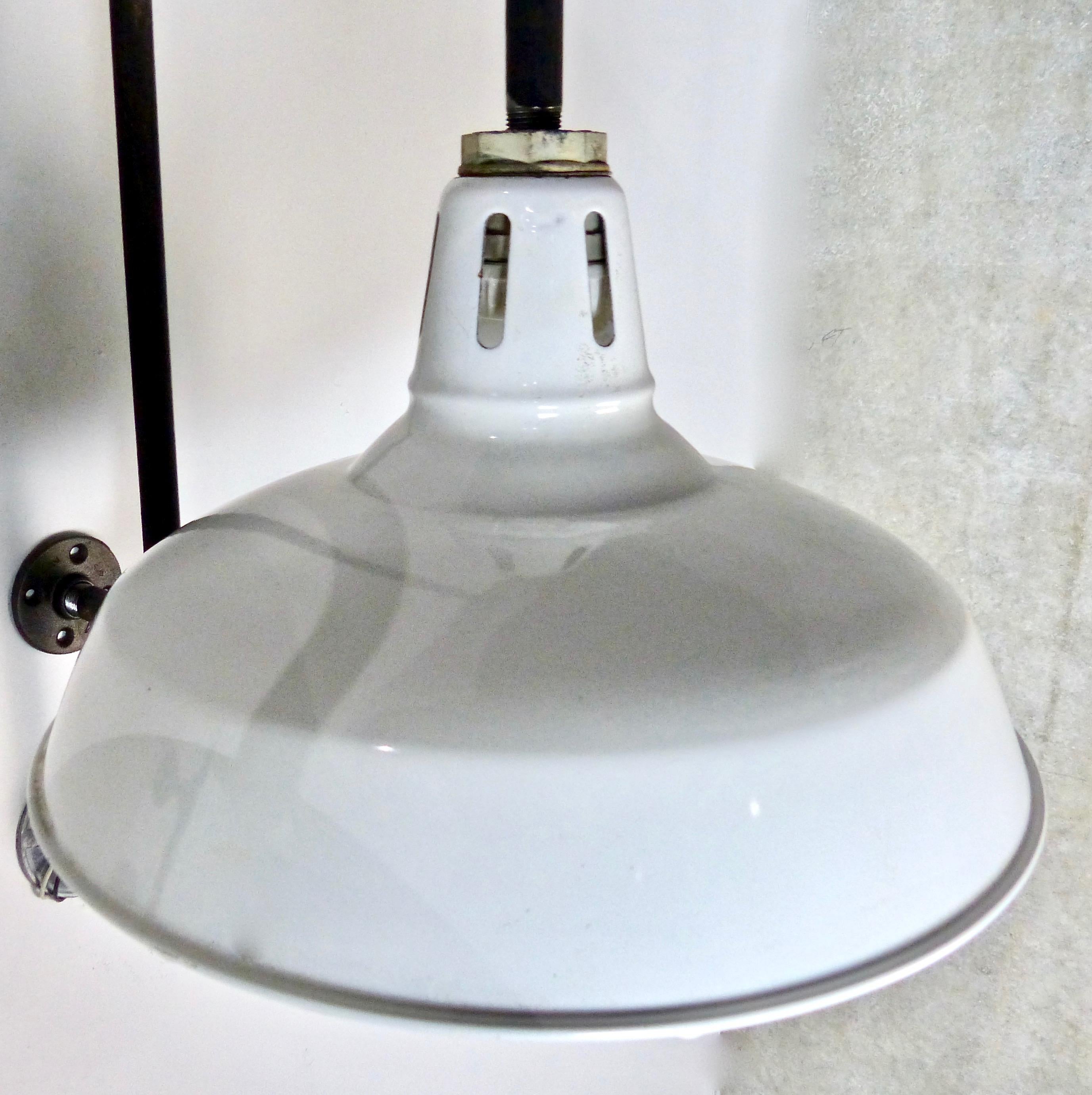 Vintage matched pair of Industrial wall-mounted sconces, circa 1940. Nice details on their original enamel shades. Re-wired and CSA approved to current electrical standards. Great look for your loft space. Price per light.
Dimensions: 27” H x 16” W