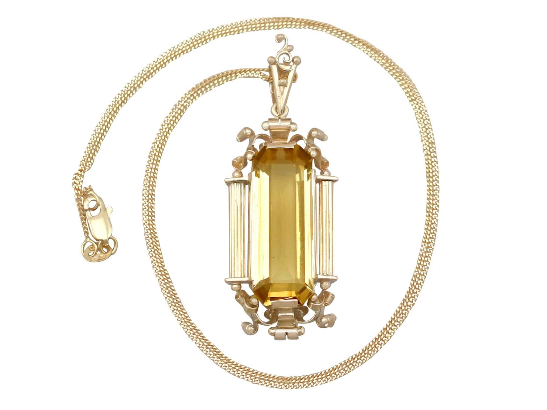 An impressive vintage 1940's 10.98 carat citrine and 14 karat yellow gold pendant and contemporary chain; part of our diverse gemstone jewellery collections.

This fine and impressive citrine pendant has been crafted in 14k yellow gold.

The