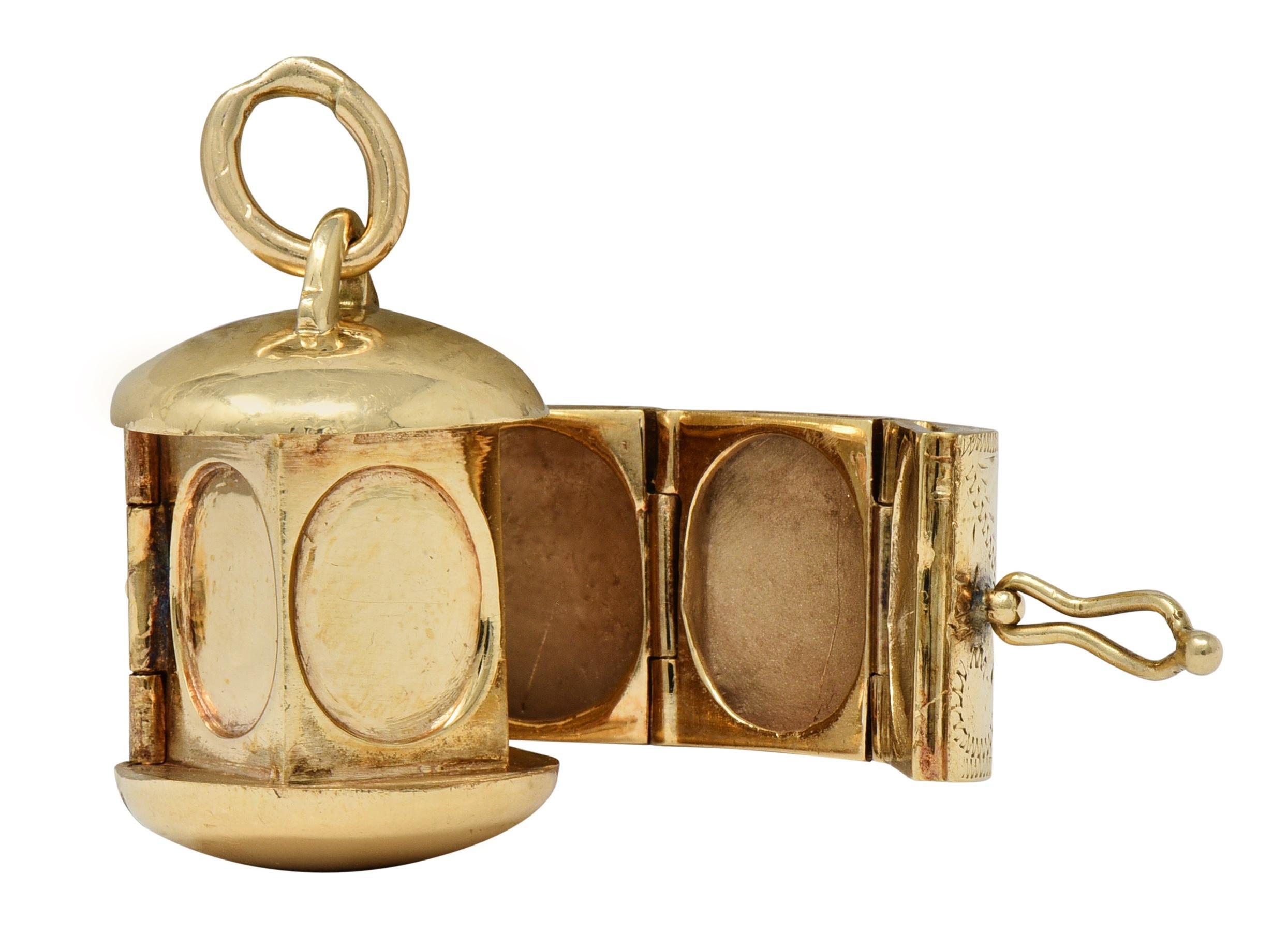 Designed as a cylindrical form engraved with scrolling flourished throughout
Featuring a hinged clasp that opens to unravel five hinged frames
With four additional frames on central pillar - each oval shaped
Measuring 8.0 x 10.0 mm with pierced and