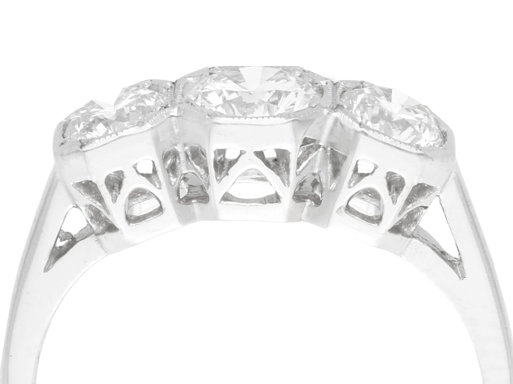 An impressive vintage 1940s 1.49 carat diamond and platinum three stone ring; part of our diverse vintage jewelry and estate jewelry collections.

This fine and impressive trilogy engagement ring has been crafted in platinum.

The pierced decorated,