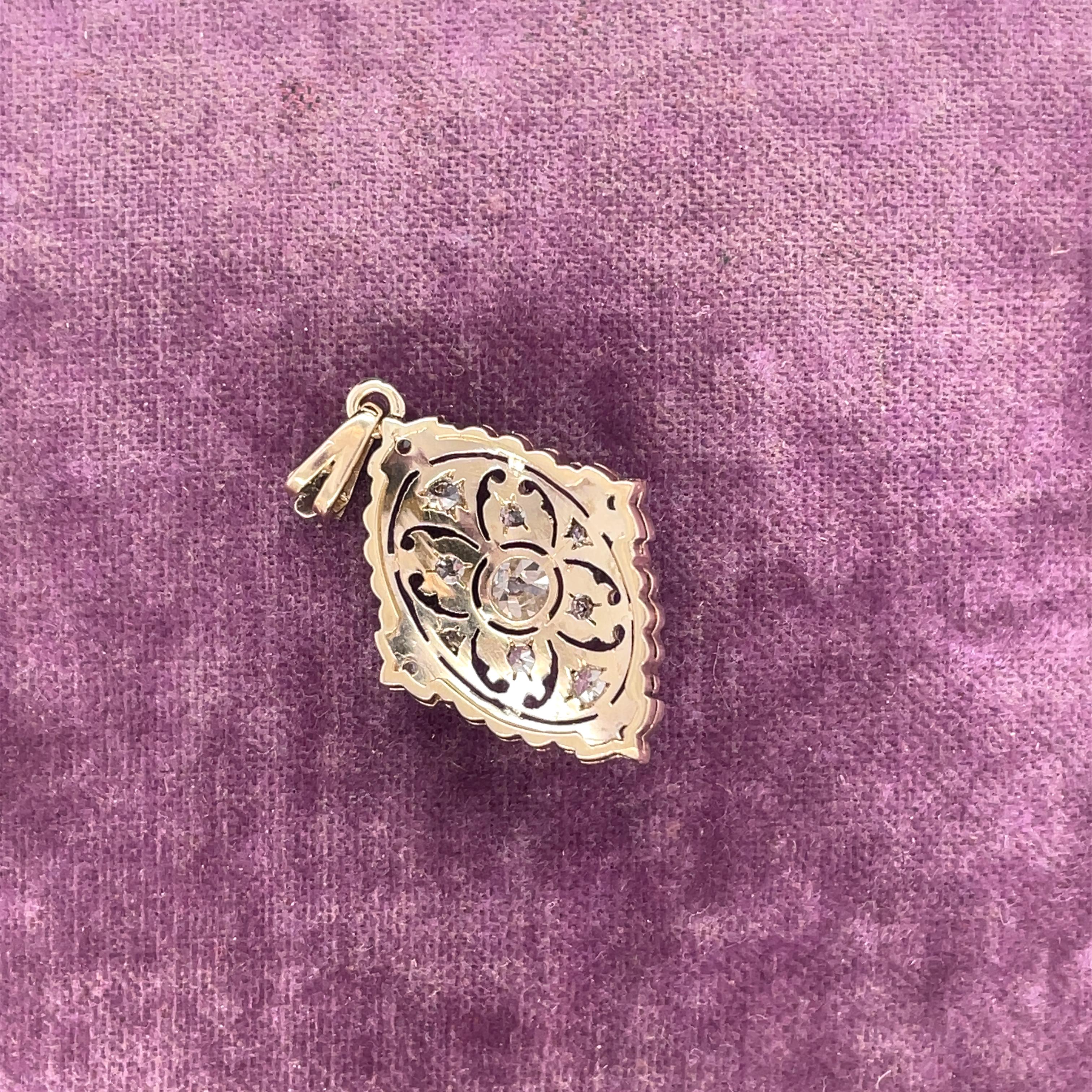 Year: 1940s

Item Details: 
Metal Type:  14k Gold [Hallmarked, and Tested]
Weight:  3.0 grams

Diamond Details:
Weight: .50ct, total weight
Cut: Old European brilliant
Color: H
Clarity: VS

Pendant Measurement: 1.20 inches x .70 inches
Condition: 