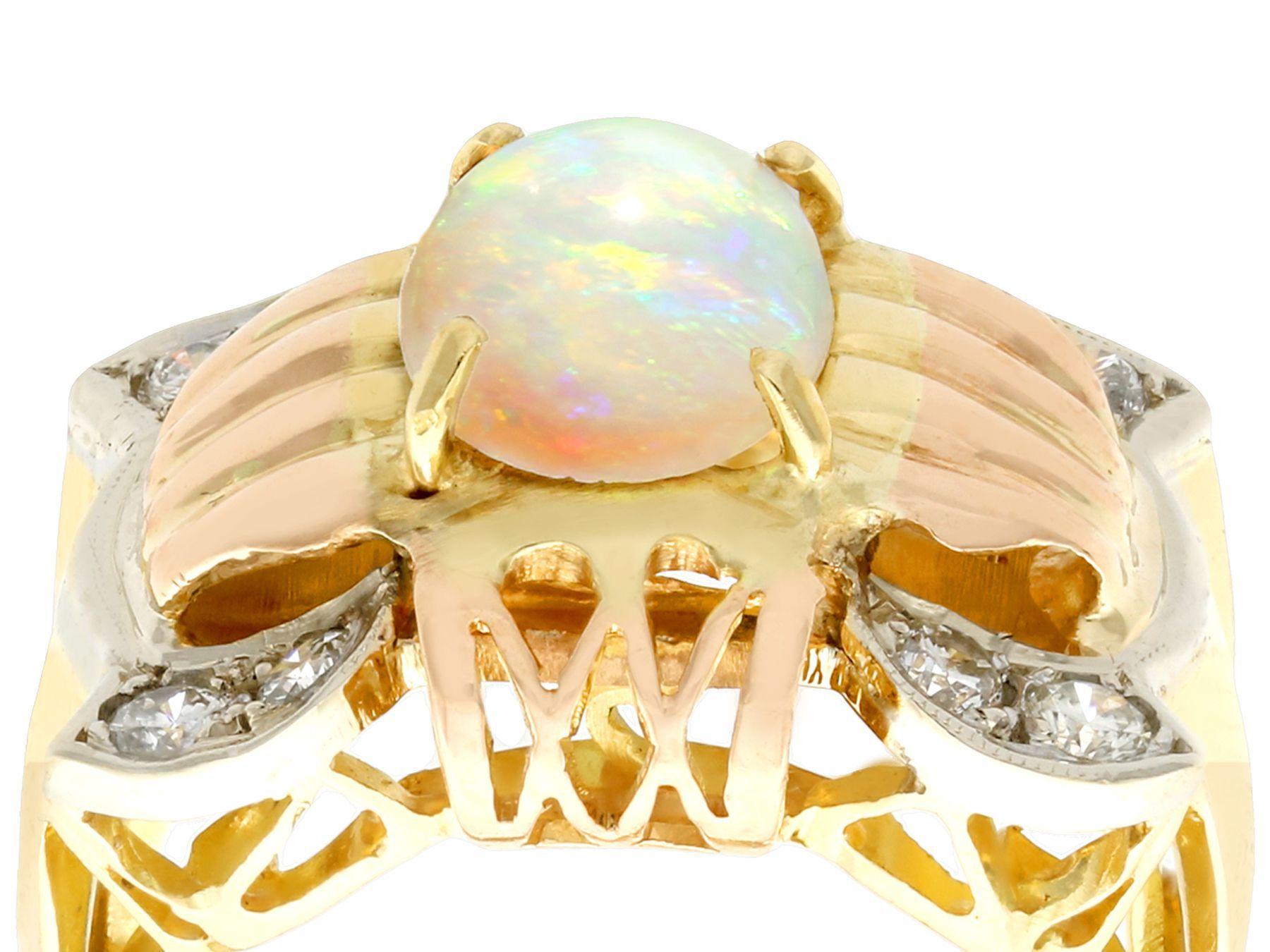A stunning vintage 1.55 carat white opal and 0.52 carat diamond, 18 karat yellow, rose and white gold dress ring; part of our diverse antique jewelry and estate jewelry collections.

This stunning, fine and impressive opal band ring has been crafted