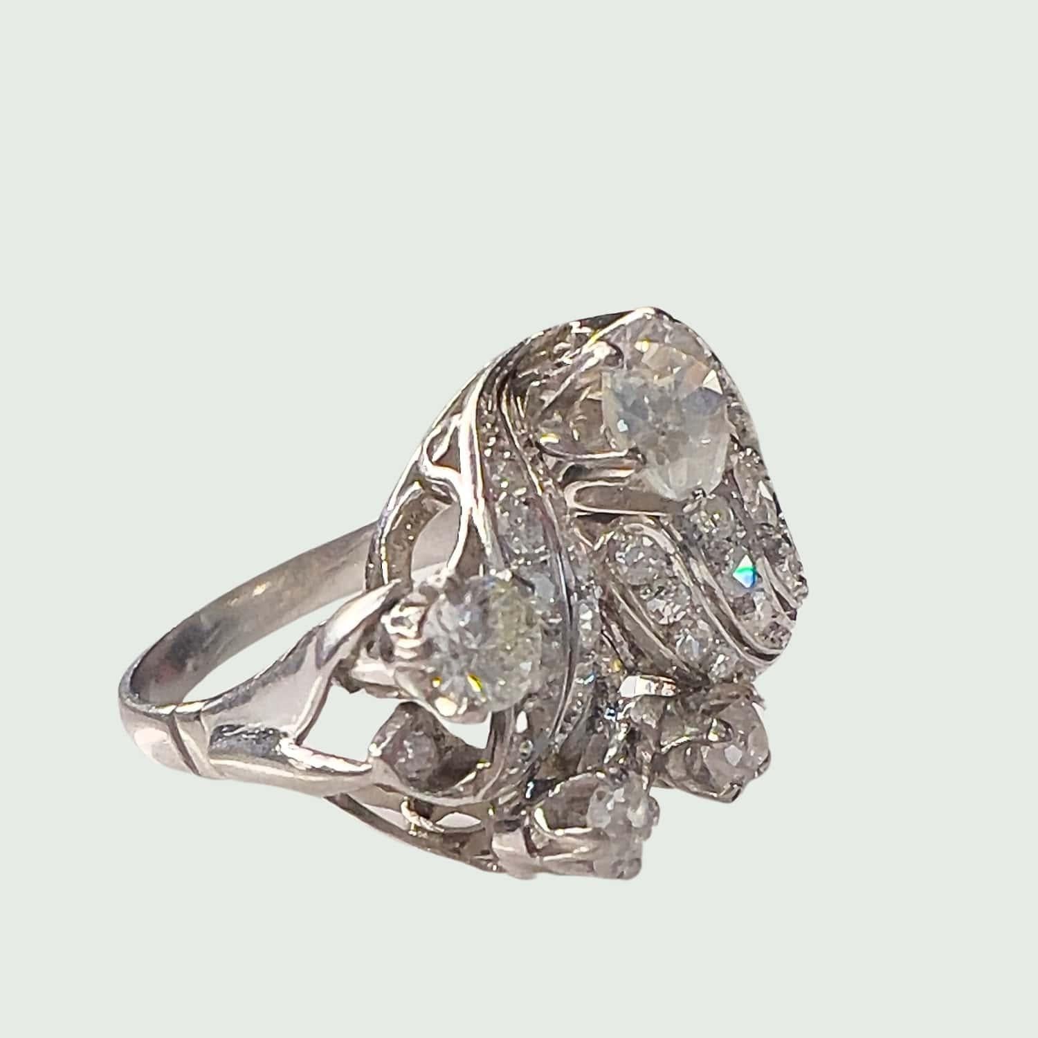 Step back in time with this retro-style ring from the 1940s-1945 period, crafted in platinum 950 kts and adorned with antique and single-cut diamonds. 
The main stone boasts 0.85 carats with VS clarity and H color, while the remaining stones total