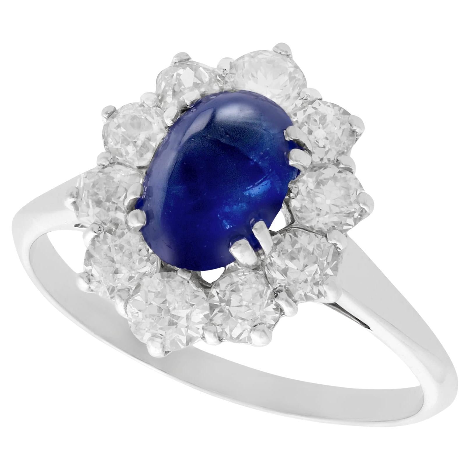 1940s 2.17 Carat Cabochon Cut Sapphire and Diamond Gold Cluster Ring